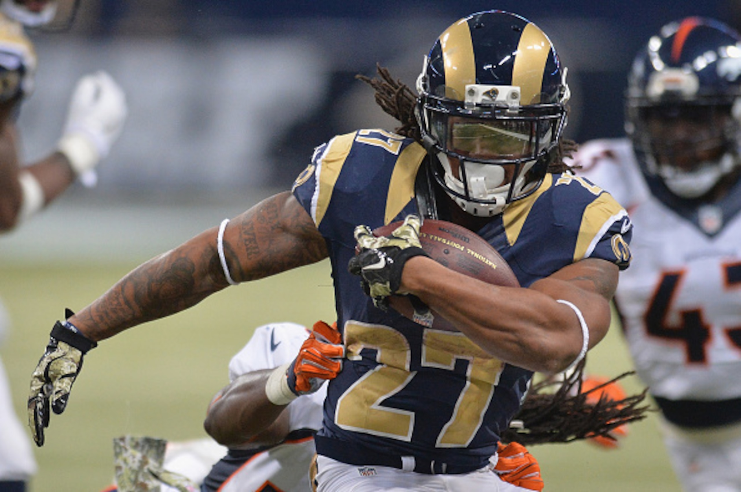 ST. LOUIS, MO - NOVEMBER 16: Tre Mason #27 of the St. Louis Rams rushes against the Denver Broncos in the third quarter at the Edward Jones Dome on November 16, 2014 in St. Louis, Missouri. The Rams defeated the Broncos 22-7. (Photo by Michael B. Thomas/G