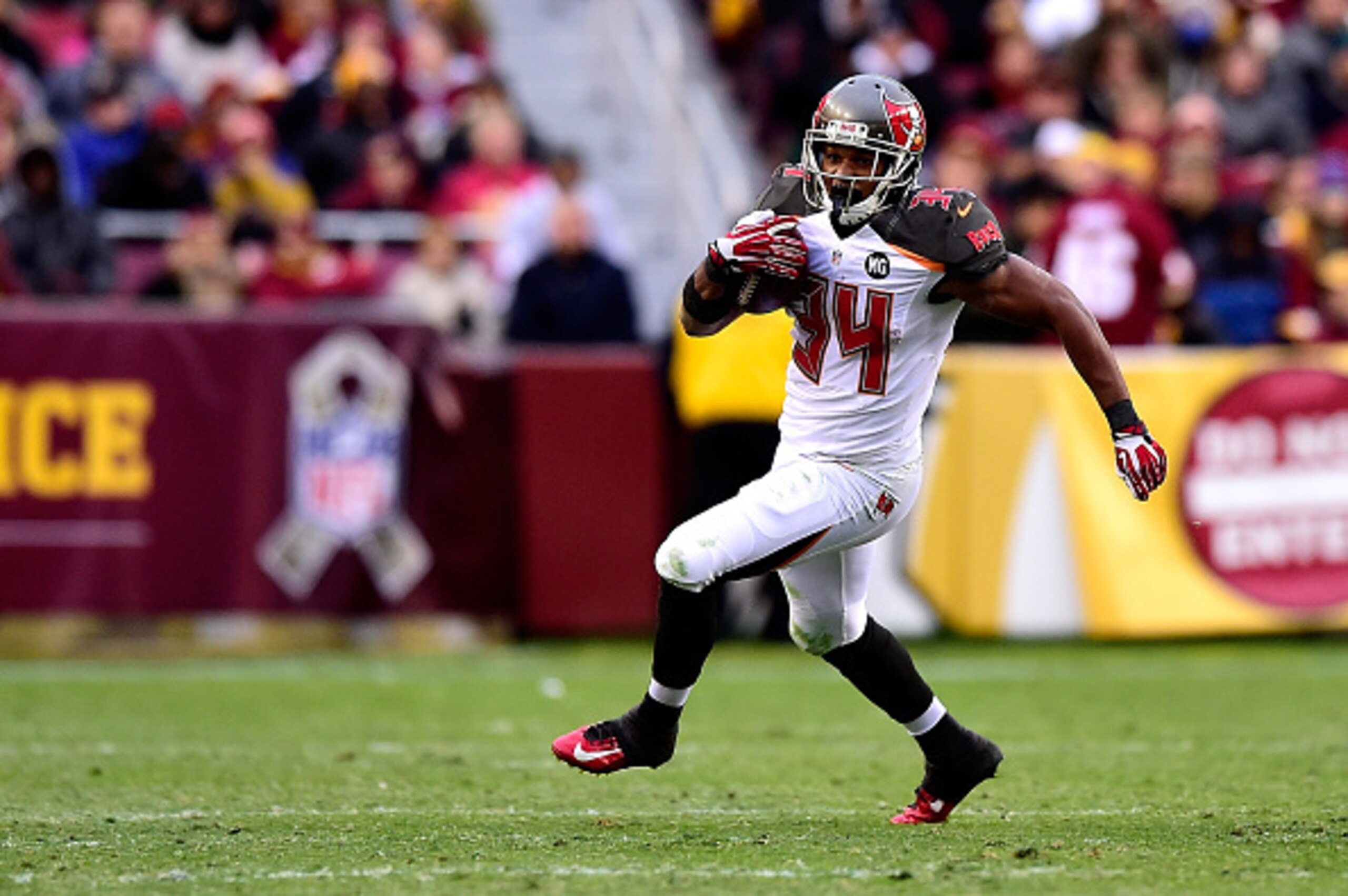 LANDOVER, MD - NOVEMBER 16: Running back Charles Sims #34 of the Tampa Bay Buccaneers rushes in the second half of a game against the Washington Redskins at FedExField on November 16, 2014 in Landover, Maryland.  (Photo by Patrick McDermott/Getty Images)