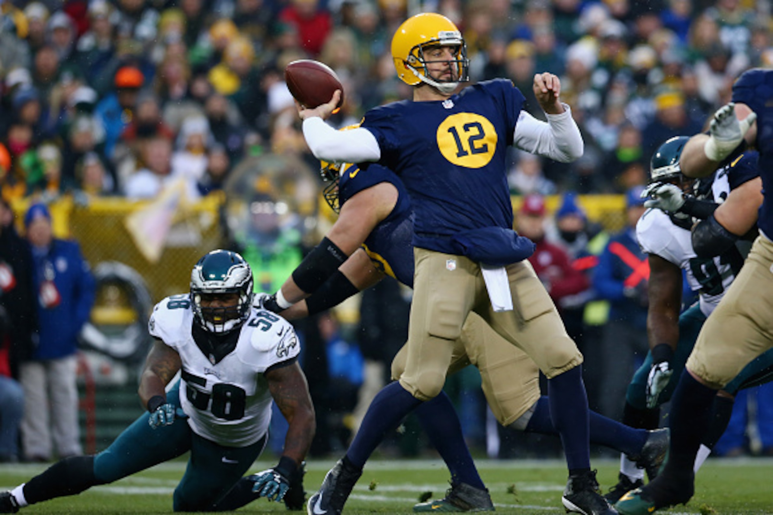 GREEN BAY, WI - NOVEMBER 16:  Quarterback  Aaron Rodgers #12 of the Green Bay Packers looks to pass against the Philadelphia Eagles during the first quarter of the game at Lambeau Field on November 16, 2014 in Green Bay, Wisconsin.  (Photo by Ronald Marti