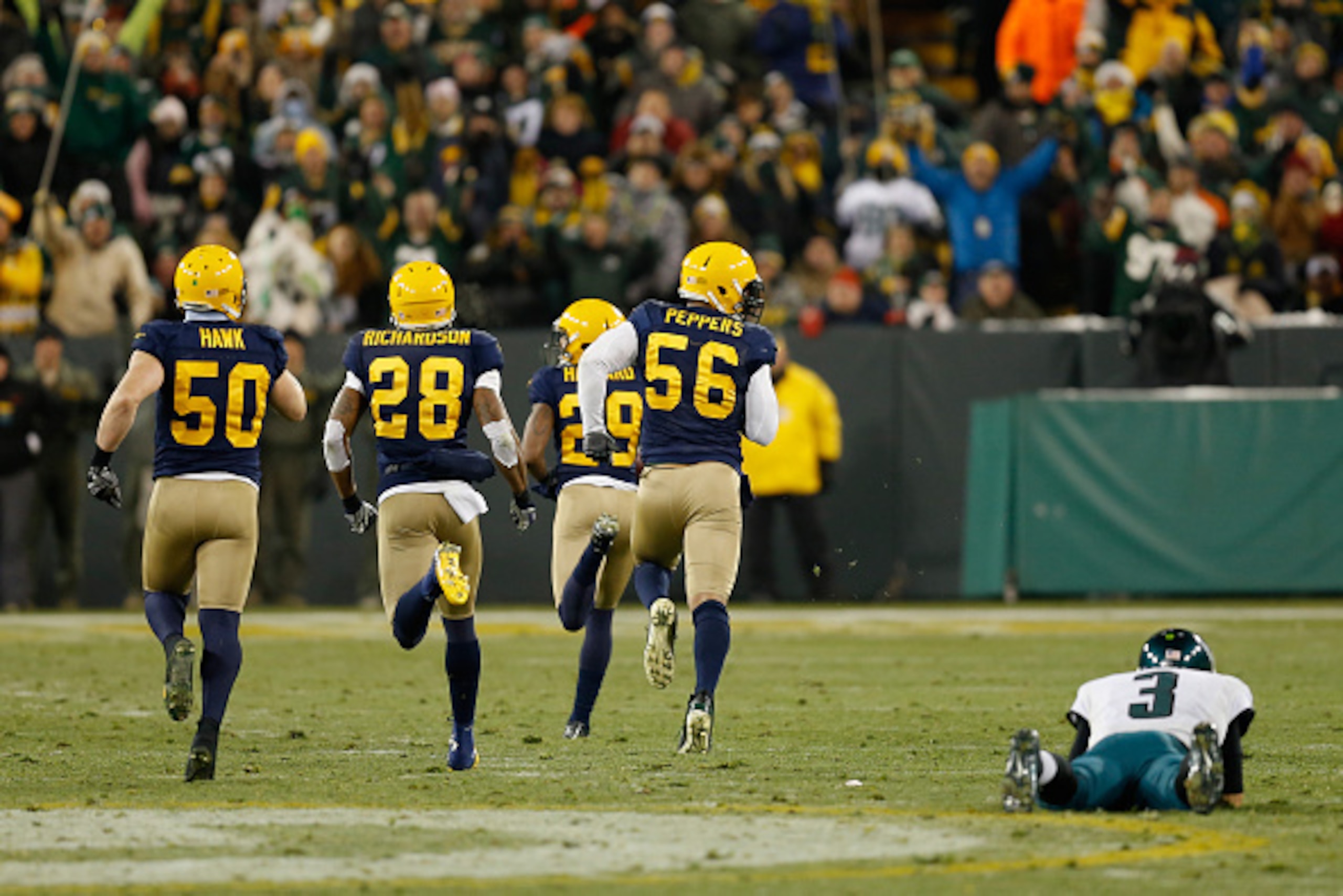 GREEN BAY, WI - NOVEMBER 16:   Casey Hayward #29 of the Green Bay Packers runs a fumble by quarterback  Mark Sanchez #3 of the Philadelphia Eagles for a touchdown during the fourth quarter of the game at Lambeau Field on November 16, 2014 in Green Bay, Wi