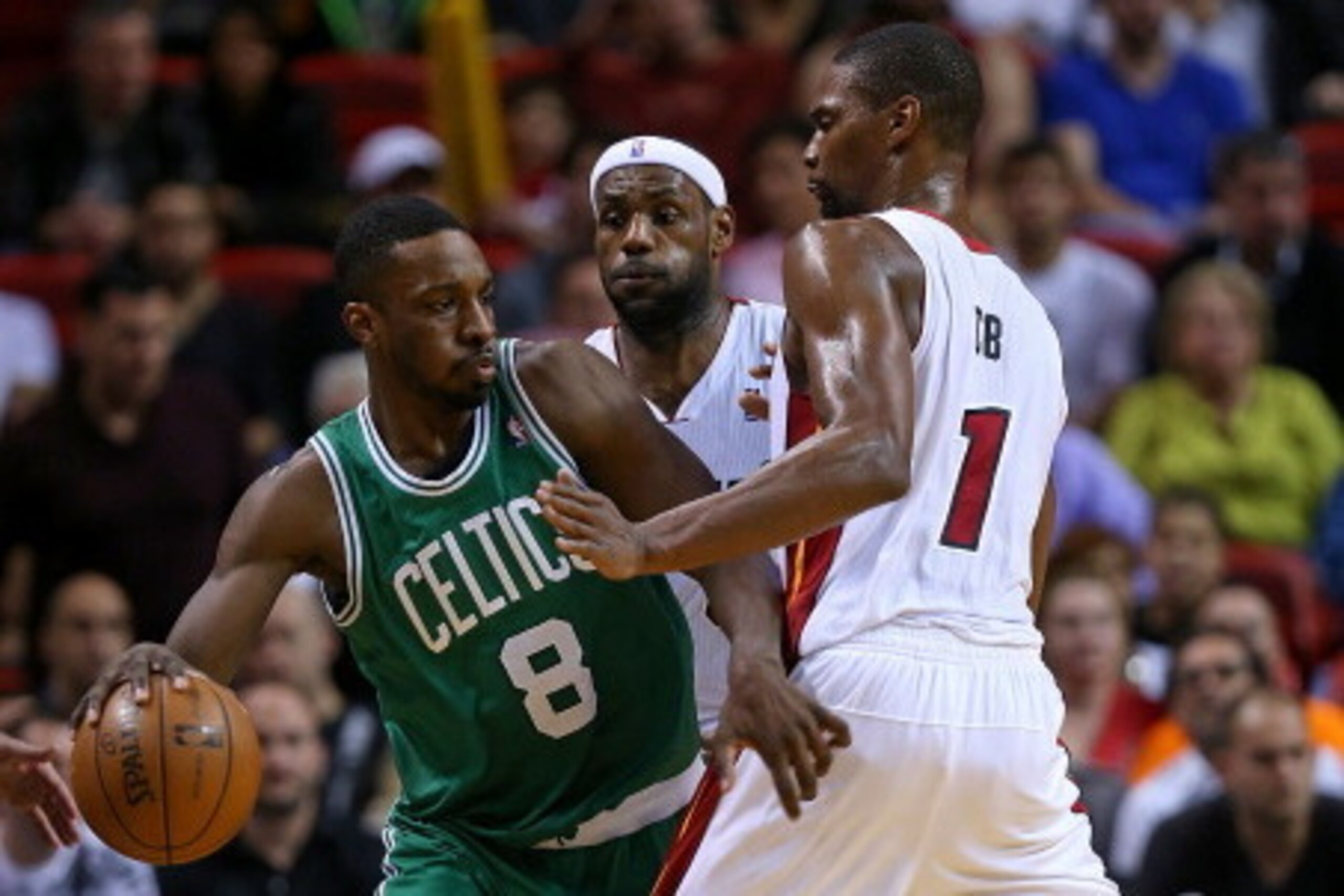 MIAMI, FL - JANUARY 21: Jeff Green #8 of the Boston Celtics is guarded by LeBron James #6 and Chris Bosh #1 of the Miami Heat during a game  at AmericanAirlines Arena on January 21, 2014 in Miami, Florida. NOTE TO USER: User expressly acknowledges and agr