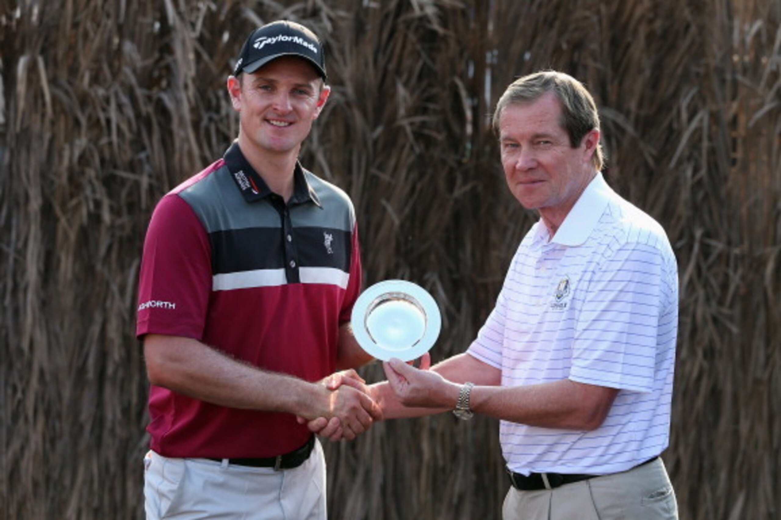 DUBAI, UNITED ARAB EMIRATES - NOVEMBER 15:  Justin Rose of England is presented with the Golfer of the Month Award for June by George O'Grady, Chief Executive of The European Tour, after the second round of the DP World Tour Championship, Dubai on the Ear