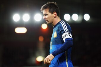 LONDON, ENGLAND - NOVEMBER 12:  Lionel Messi of Argentina looks on during the International Friendly between Argentina and Croatia at Boleyn Ground on November 12, 2014 in London, England.  (Photo by Bryn Lennon/Getty Images)