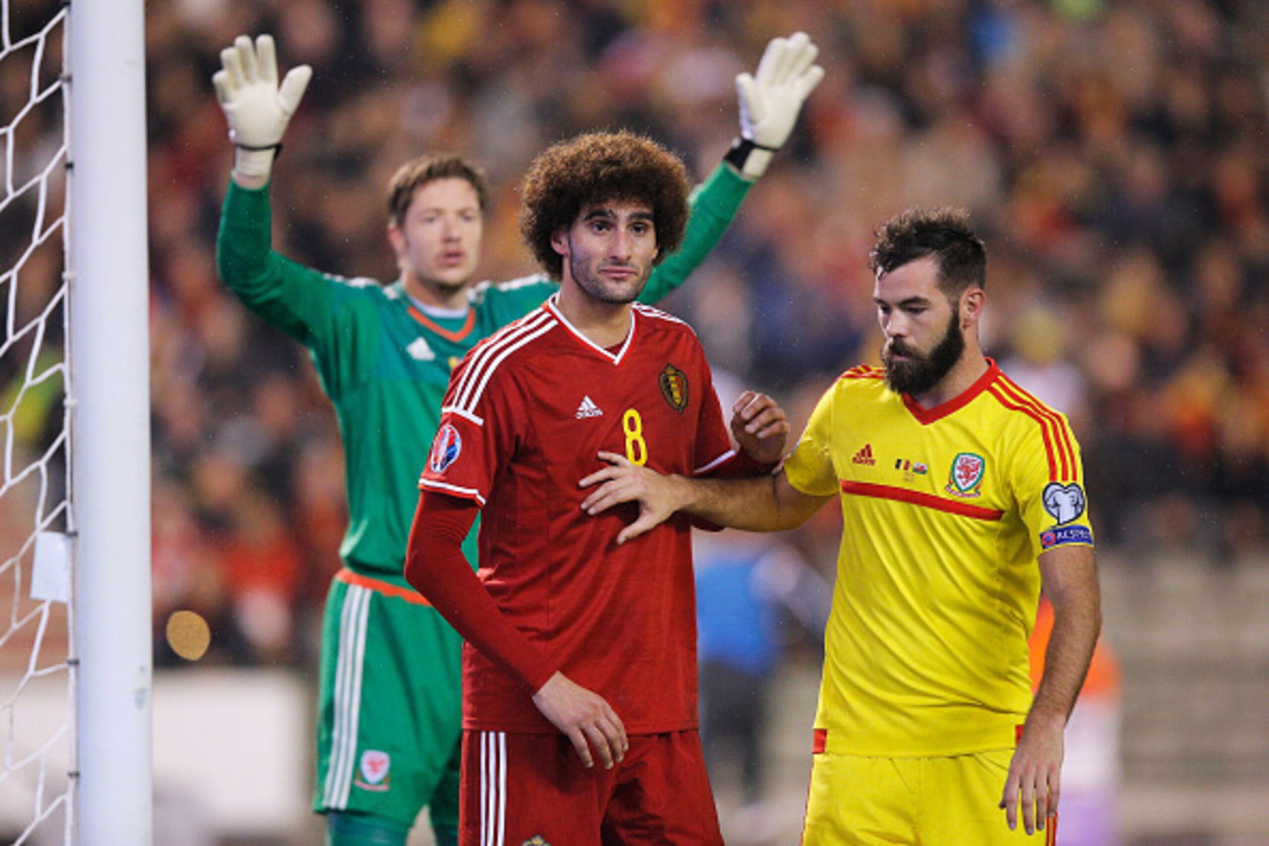 BRUSSELS, BELGIUM - NOVEMBER 16:  Marouane Fellaini of Belgium and Joe Ledley of Wales wait for the corner during the Group B UEFA European Championship 2016 Qualifier match bewteen Belgium and Wales at King Baudouin Stadium on November 16, 2014 in Brusse