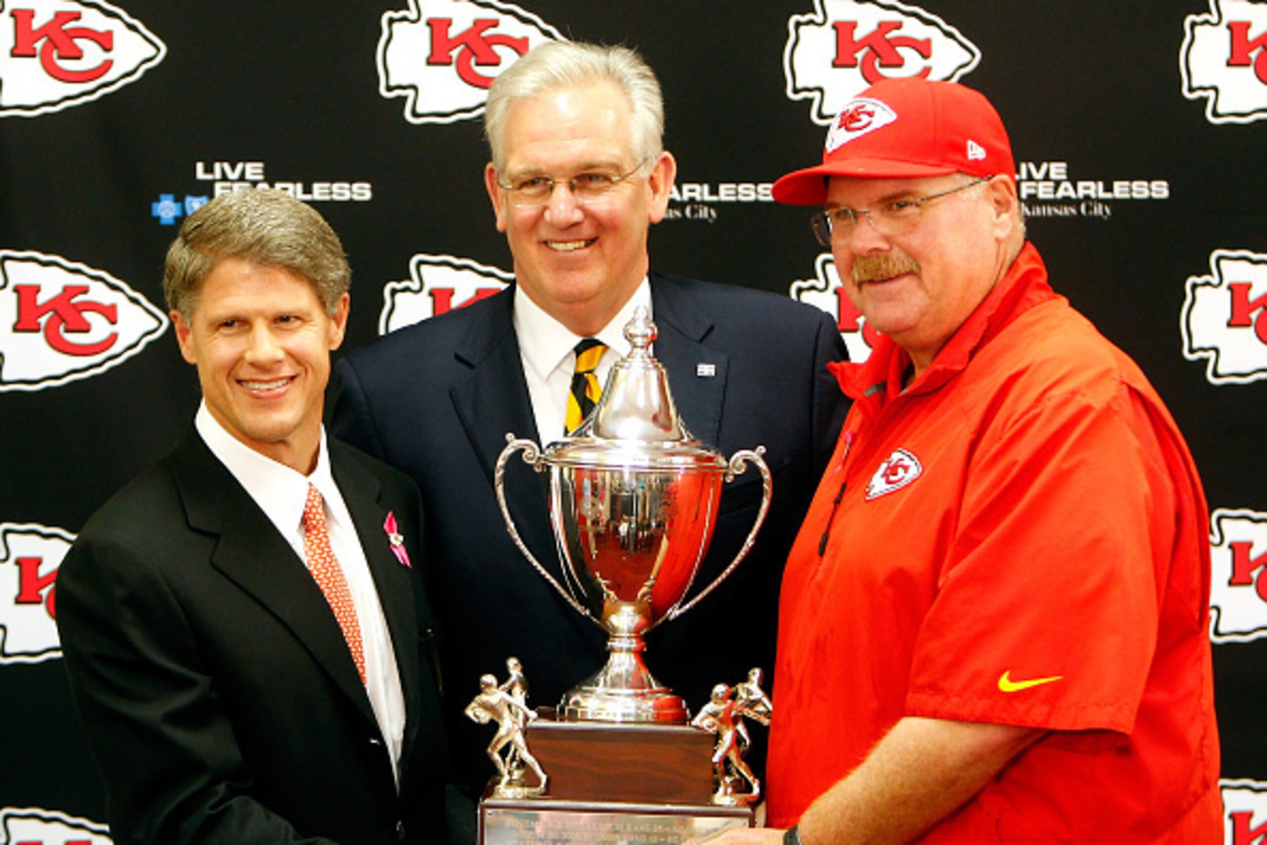 KANSAS CITY, MO - OCTOBER 26: Kansas City Chiefs owner Clark Hunt and head coach Andy Reid of the Kansas City Chiefs receive the Governor's Cup from Governor Jay Nixon of Missouri at Arrowhead Stadium on October 26, 2014 in Kansas City, Missouri. (Photo KANSAS CITY, MO - OCTOBER 26: Kansas City Chiefs owner Clark Hunt and head coach Andy Reid of the Kansas City Chiefs receive the Governor's Cup from Governor Jay Nixon of Missouri at Arrowhead Stadium on October 26, 2014 in Kansas City, Missouri. (Photo