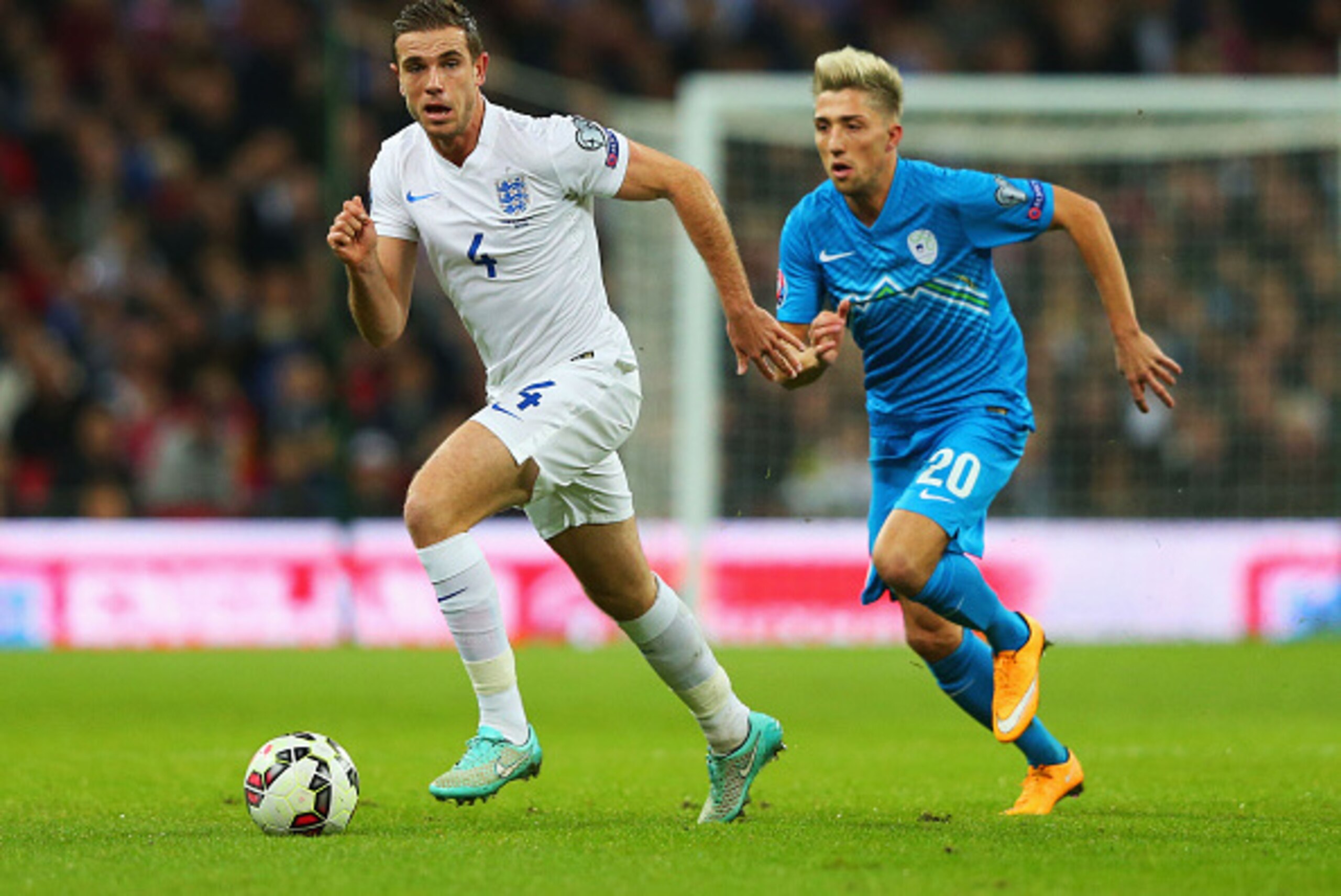 LONDON, ENGLAND - NOVEMBER 15:  Jordan Henderson of England is chased by Kevin Kampl of Slovenia during the EURO 2016 Qualifier Group E match between England and Slovenia at Wembley Stadium on November 15, 2014 in London, England.  (Photo by Alex Livesey/