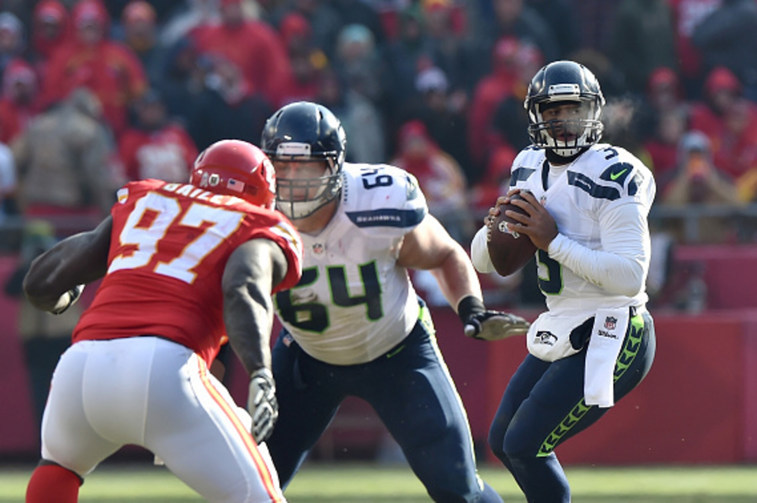 KANSAS CITY, MO - NOVEMBER 16:  Russell Wilson #3 of the Seattle Seahawks looks to pass against the Kansas City Chiefs during the game at Arrowhead Stadium on November 16, 2014 in Kansas City, Missouri.  (Photo by Peter Aiken/Getty Images)