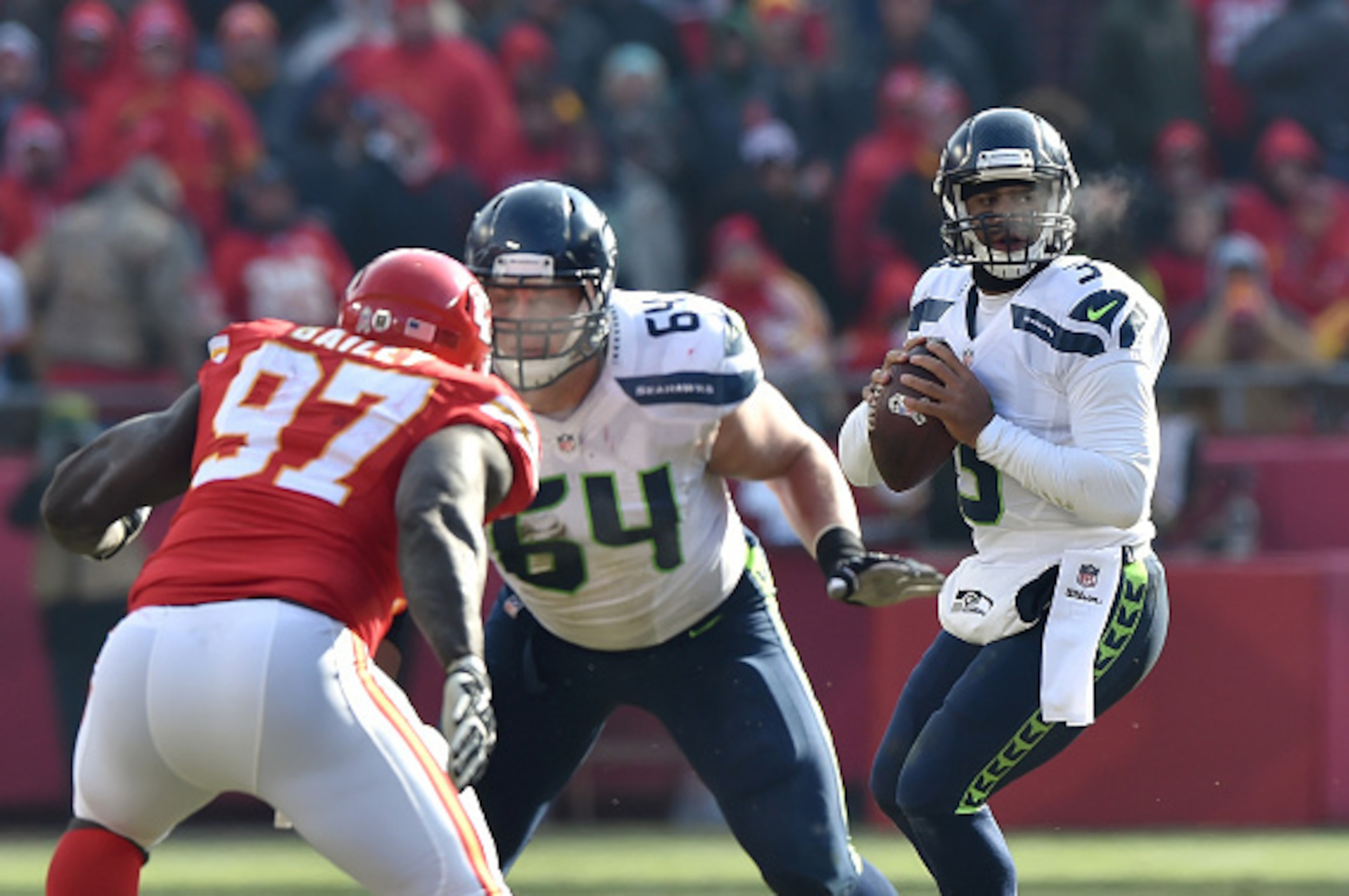 KANSAS CITY, MO - NOVEMBER 16:  Russell Wilson #3 of the Seattle Seahawks looks to pass against the Kansas City Chiefs during the game at Arrowhead Stadium on November 16, 2014 in Kansas City, Missouri.  (Photo by Peter Aiken/Getty Images)