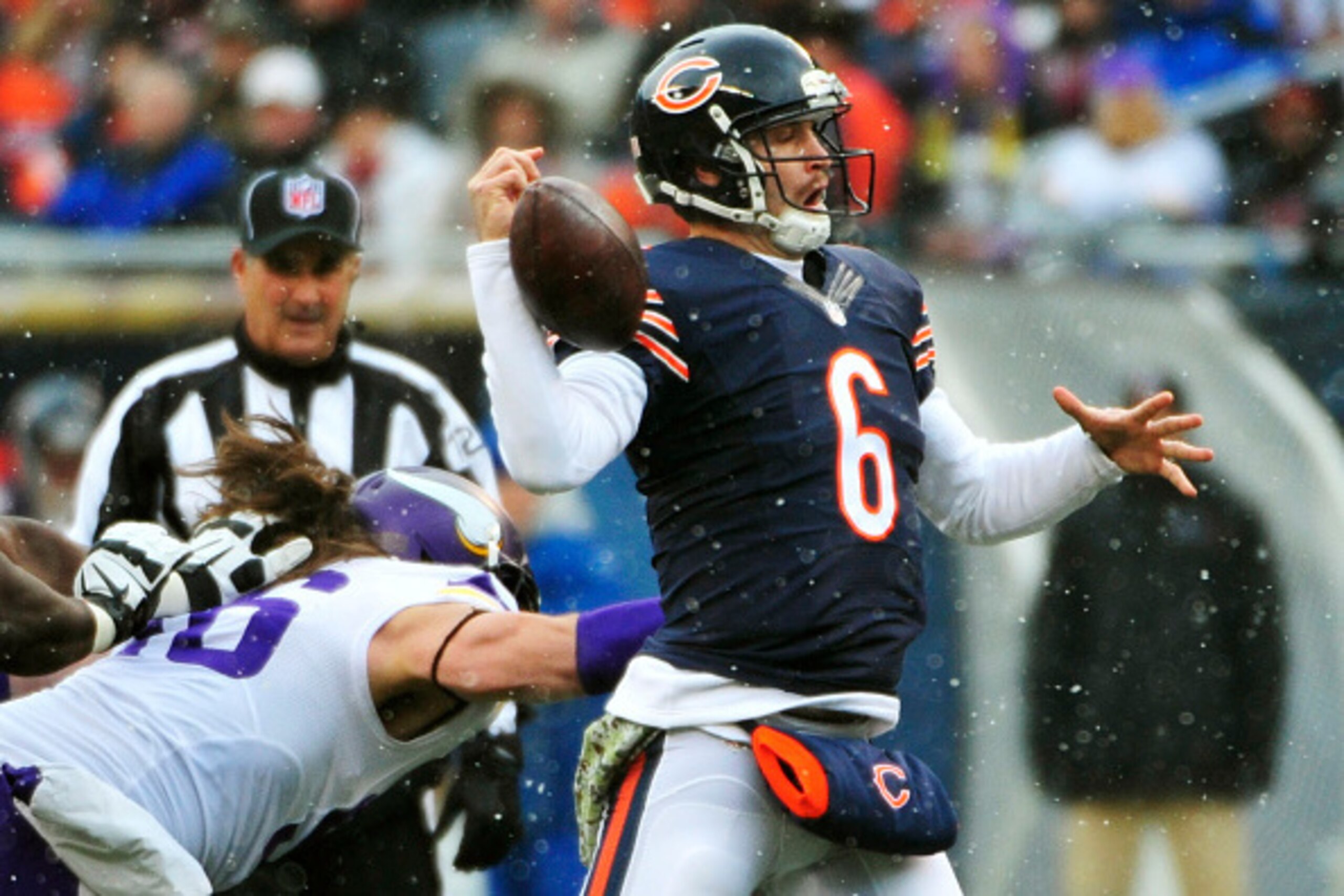 CHICAGO, IL - NOVEMBER 16:  Jay Cutler #6 of the Chicago Bears has the ball knocked loose by Brian Robison #96 of the Minnesota Vikings during the second quarter of a game against the Chicago Bears at Soldier Field on November 16, 2014 in Chicago, Illinoi