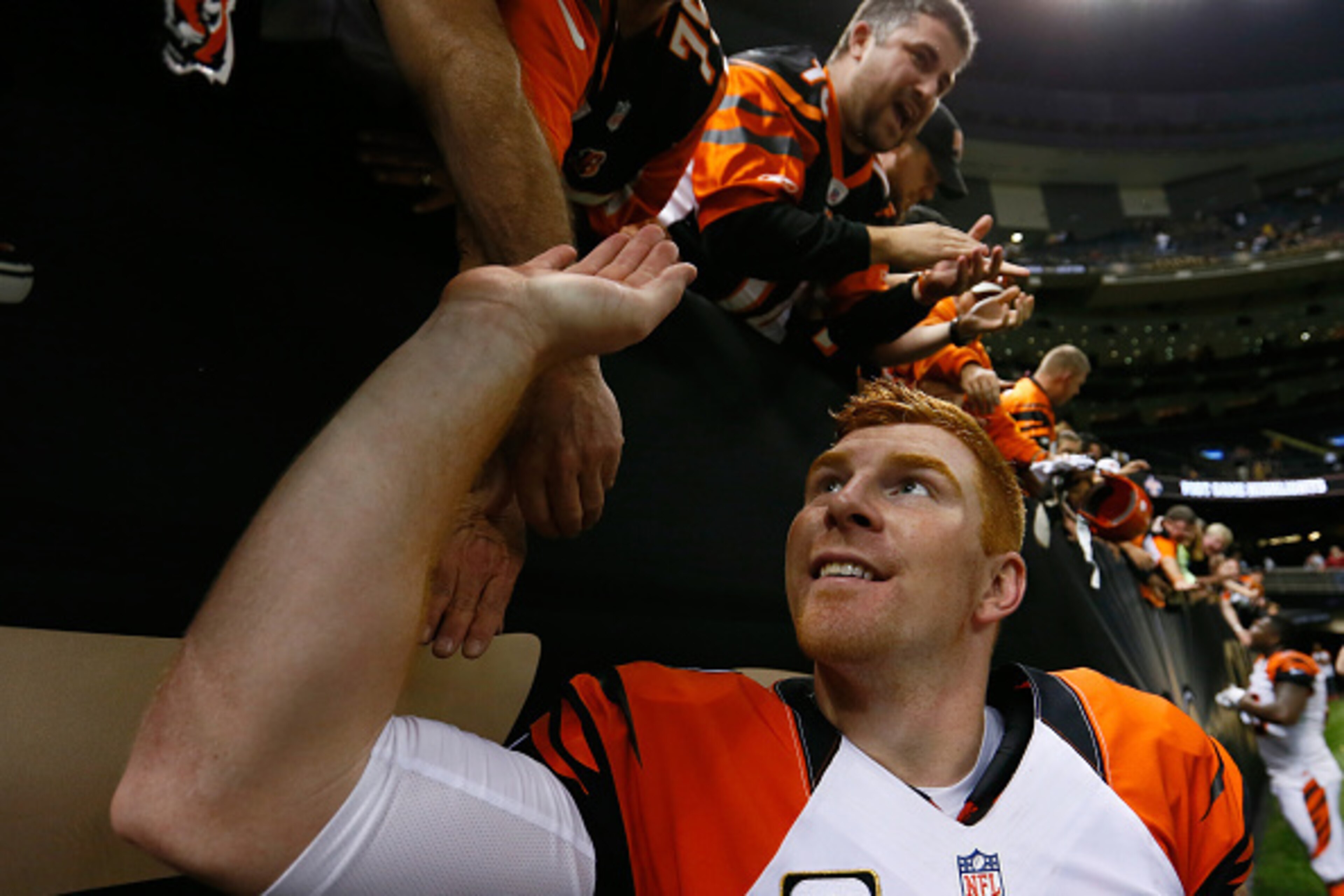 NEW ORLEANS, LA - NOVEMBER 16:  Andy Dalton #14 of the Cincinnati Bengals walks off the field after the game against the New Orleans Saints at Mercedes-Benz Superdome on November 16, 2014 in New Orleans, Louisiana.  (Photo by Kevin C. Cox/Getty Images)
