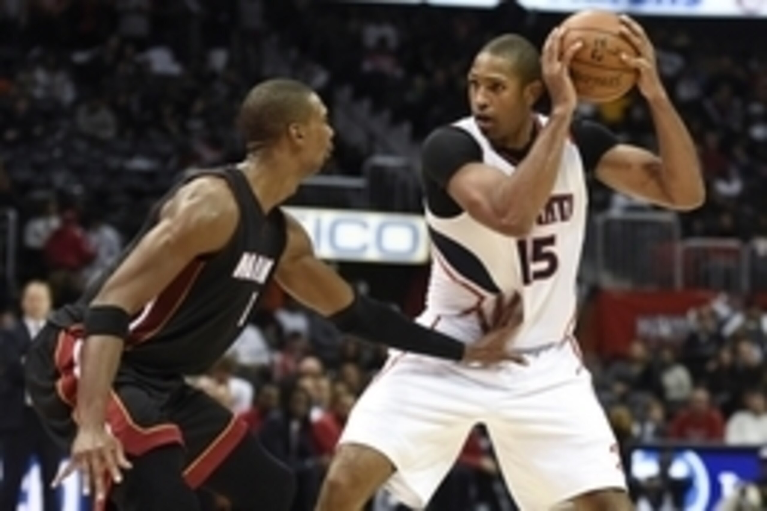 Nov 14, 2014; Atlanta, GA, USA; Miami Heat center Chris Bosh (1) defends against Atlanta Hawks center Al Horford (15) during the second half at Philips Arena. The Hawks defeated the Heat 114-103. Mandatory Credit: Dale Zanine-USA TODAY Sports