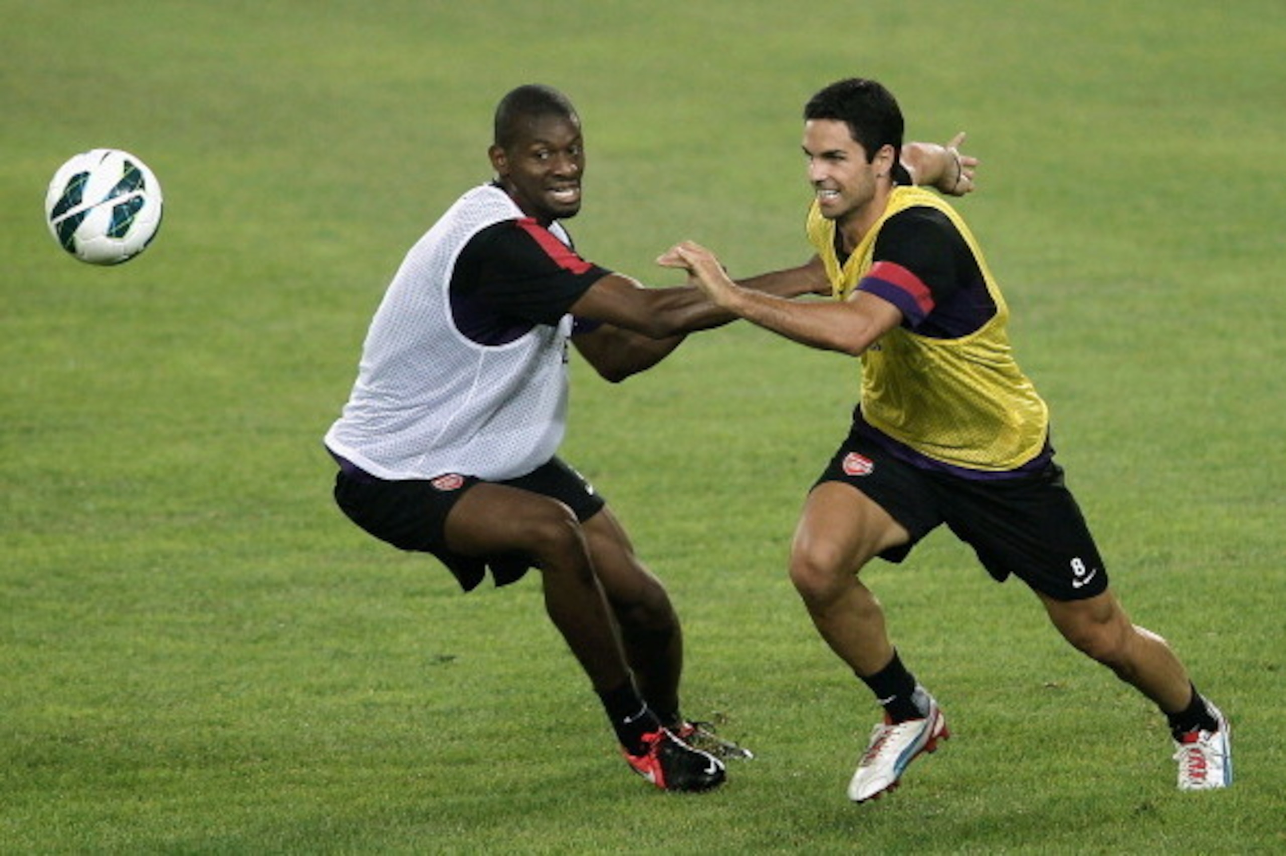 BEIJING, CHINA - JULY 26: Abou Diaby (L) and Mikel Arteta of Arsenal during a training session during the club's pre-season Asian tour at the Olympic Sports Centre on July 26, 2012 in Beijing, China..  (Photo by Lintao Zhang/Getty Images)