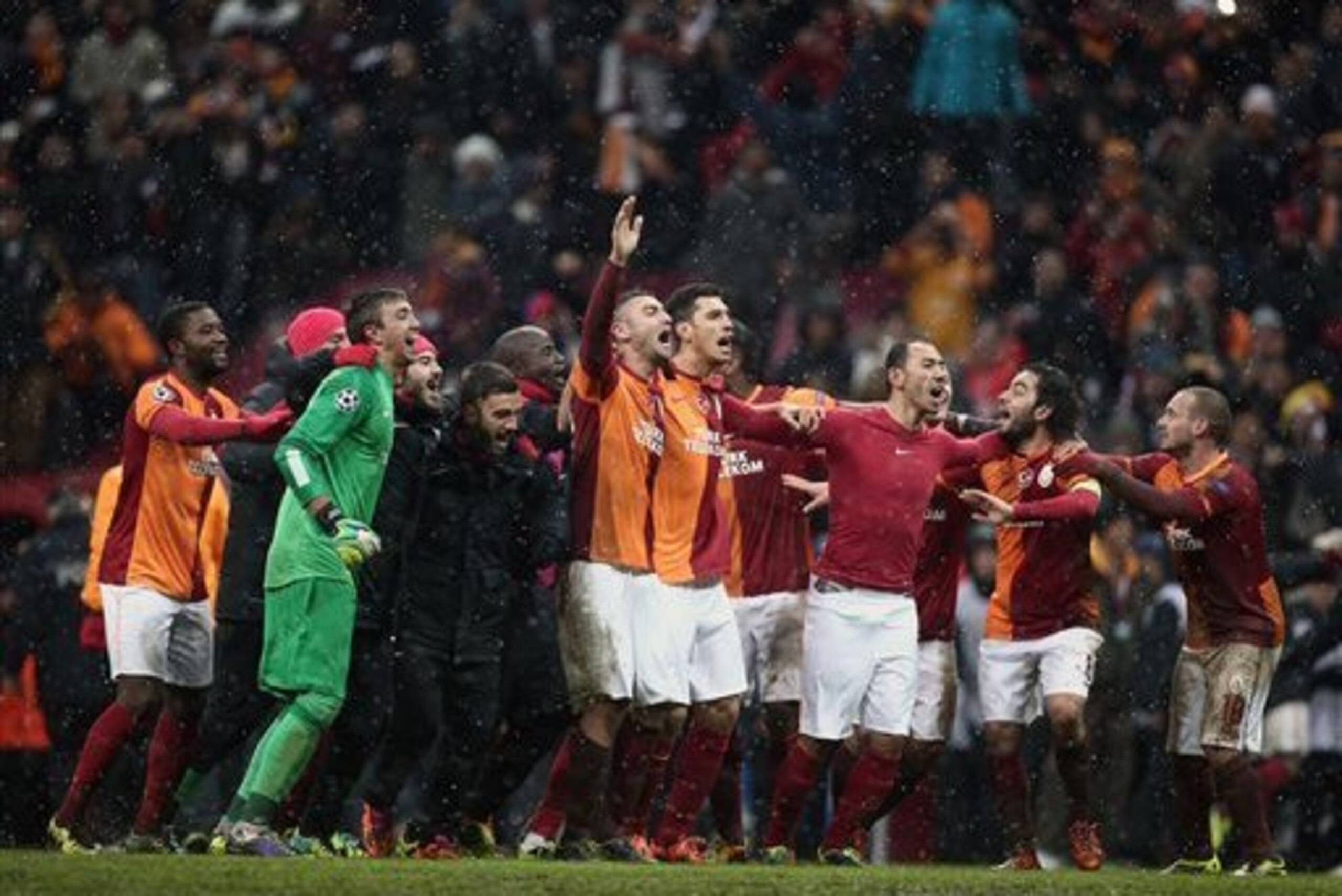 Sneijder, right, has been winning trophies and playing Champions League football with Galatasaray.