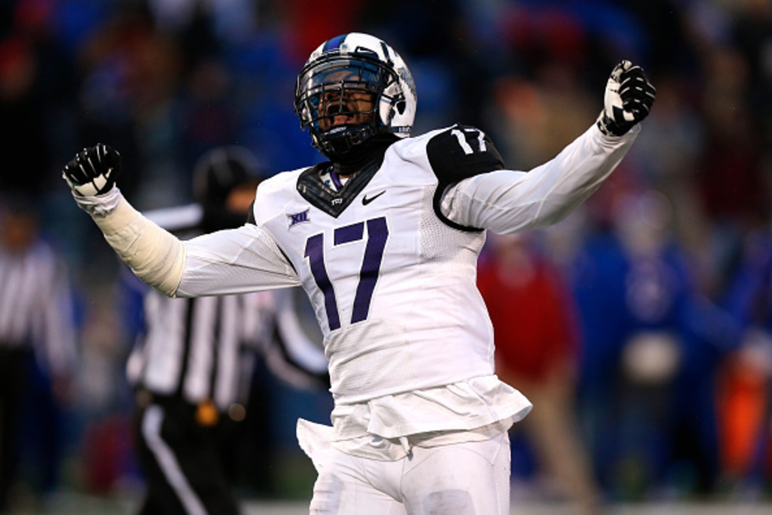 LAWRENCE, KS - NOVEMBER 15:  Sam Carter #17 of the TCU Horned Frogs celebrates after holding the Kansas Jayhawks on third down in third quarter at Memorial Stadium on November 15, 2014 in Lawrence, Kansas. TCU won 34-30. (Photo by Ed Zurga/Getty Images)
