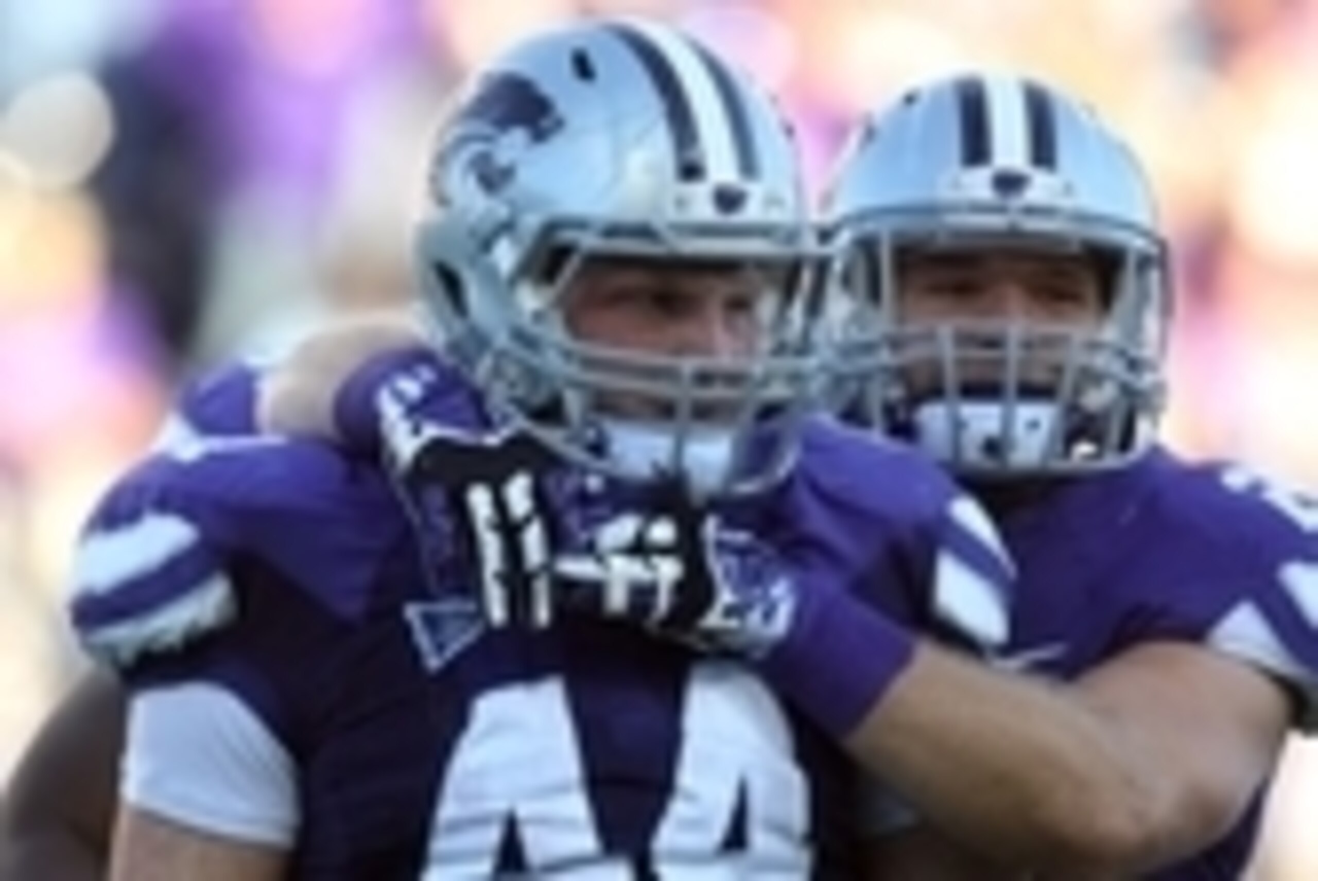 Oct 12, 2013; Manhattan, KS, USA; Kansas State Wildcats defensive end Ryan Mueller (44) is congratulated by teammate Jonathan Truman (21) for a fumble recovery during a 35-25 loss to the Baylor Bears at Bill Snyder Family Stadium. Mandatory Credit: Scott 