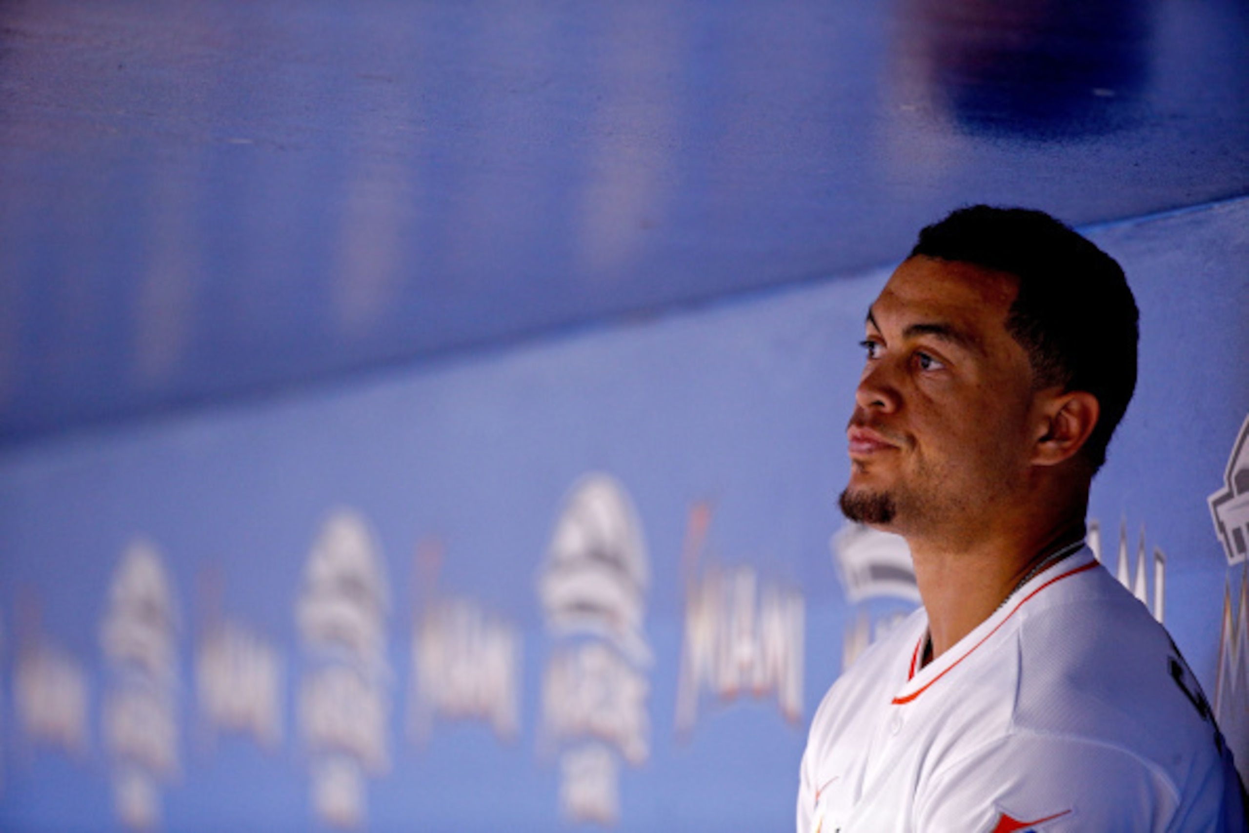 MIAMI, FL - SEPTEMBER 02: Giancarlo Stanton #27 of the Miami Marlins looks on from the dugout during the sixth inning of the game against the New York Mets at Marlins Park on September 2, 2014 in Miami, Florida.  (Photo by Rob Foldy/Getty Images)