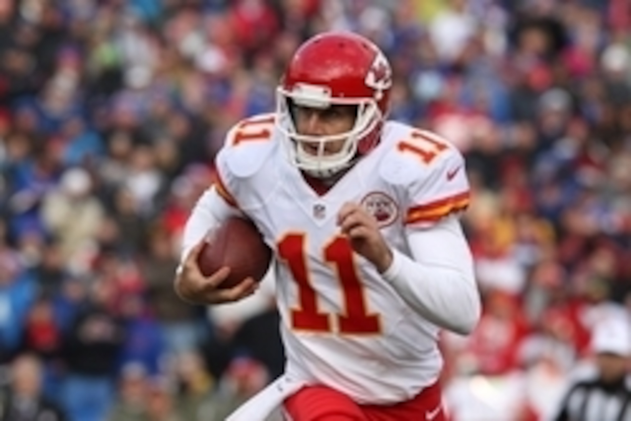 Nov 9, 2014; Orchard Park, NY, USA; Kansas City Chiefs quarterback Alex Smith (11) runs the ball into the endzone for a second half touchdown against the Buffalo Bills at Ralph Wilson Stadium. Kansas City beats Buffalo 17 to 13.  Mandatory Credit: Timothy