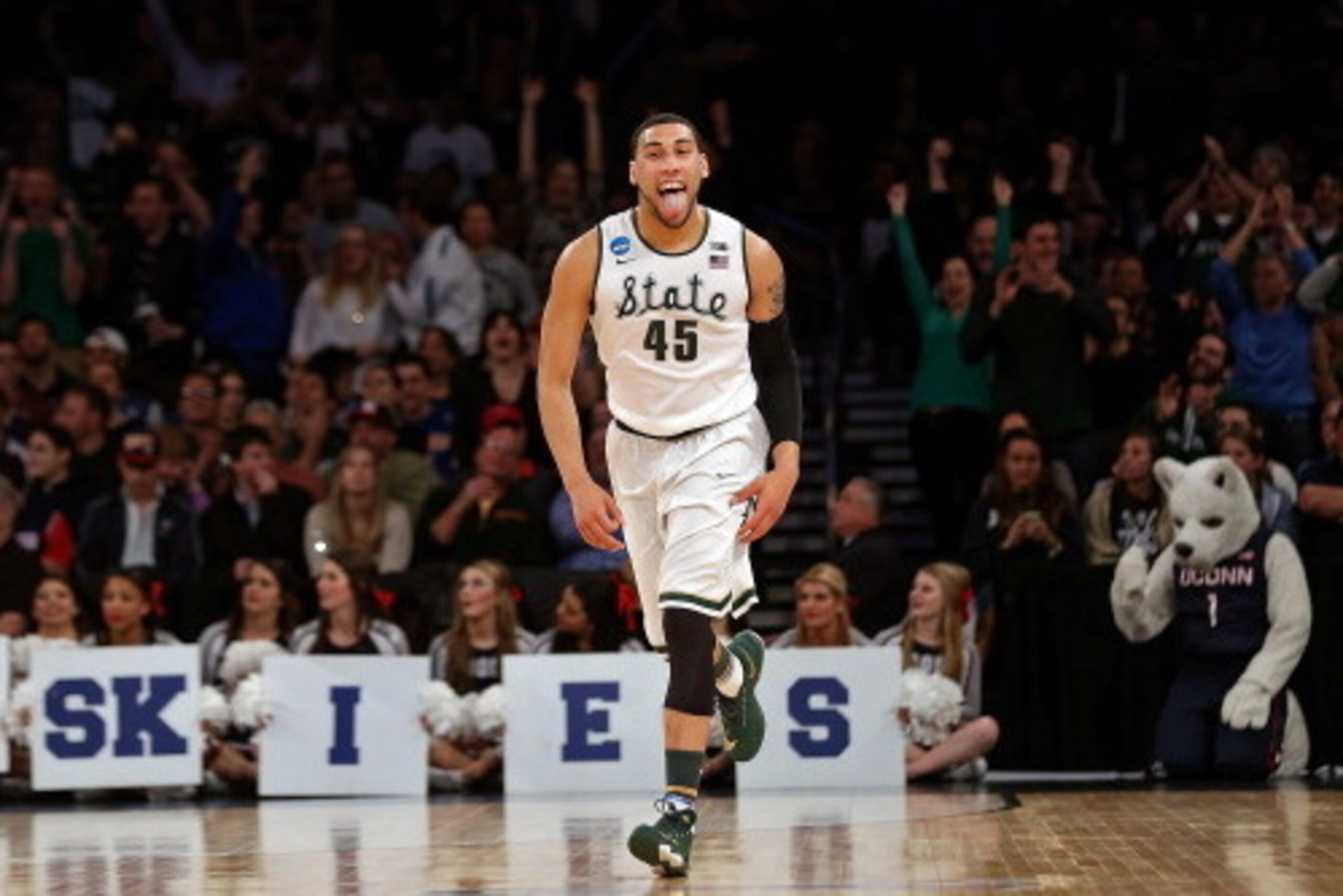 NEW YORK, NY - MARCH 30:  Denzel Valentine #45 of the Michigan State Spartans reacts after hitting a three pointer late in the first half against the Connecticut Huskies during the East Regional Final of the 2014 NCAA Men's Basketball Tournament at Madiso