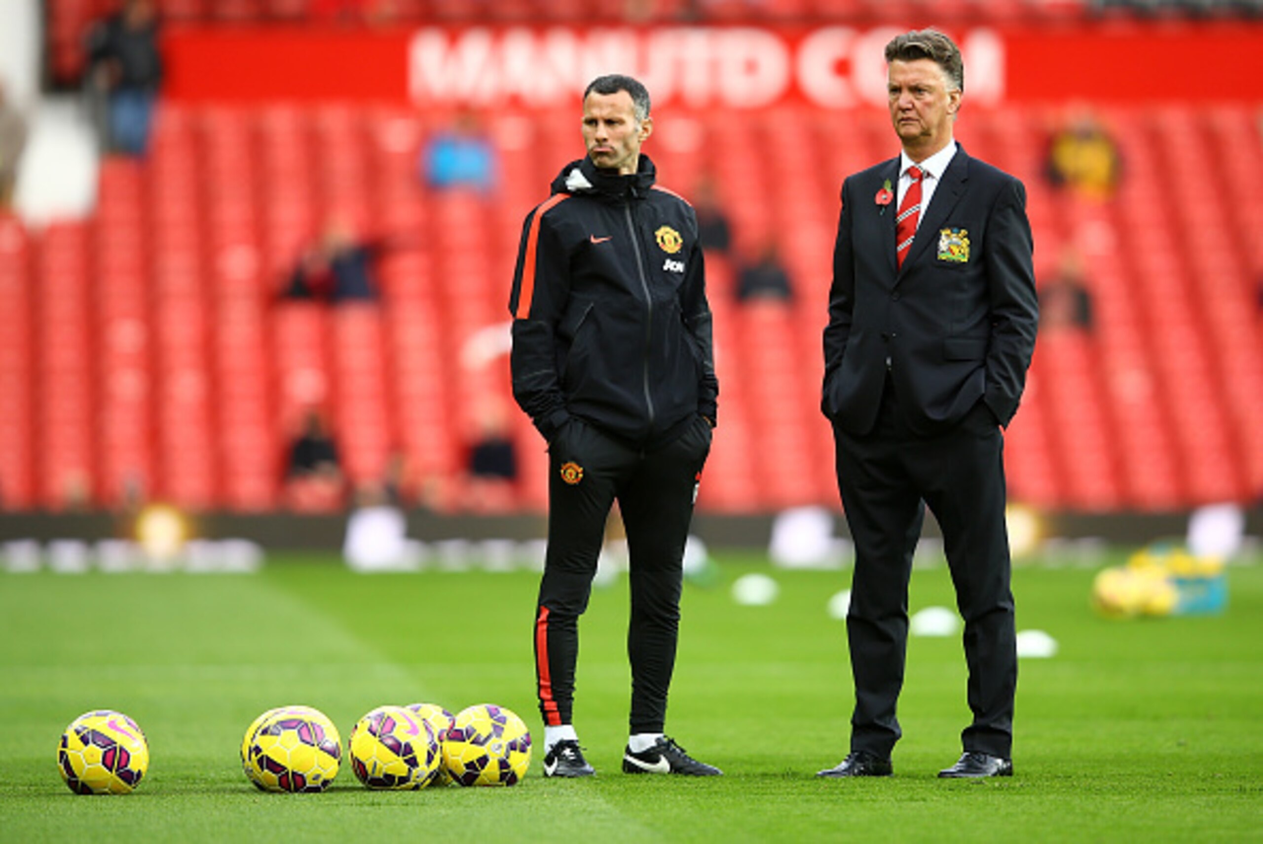 MANCHESTER, ENGLAND - NOVEMBER 08:  Manchester United Manager Louis van Gaal looks on with his Assistant Ryan Giggs (L) prior to the Barclays Premier League match between Manchester United and Crystal Palace at Old Trafford on November 8, 2014 in Manchest