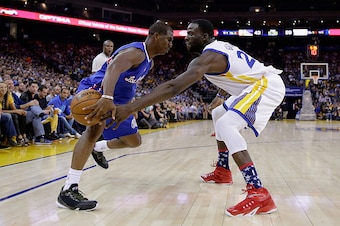OAKLAND, CA - NOVEMBER 05:  Draymond Green #23 of the Golden State Warriors tips the ball away from Chris Paul #3 of the Los Angeles Clippers at ORACLE Arena on November 5, 2014 in Oakland, California. NOTE TO USER: User expressly acknowledges and agrees 
