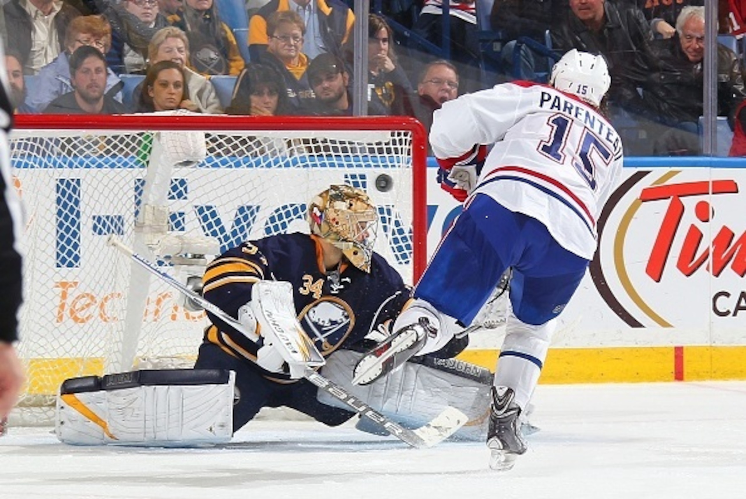 BUFFALO, NY - NOVEMBER 05: P.A. Parenteau #15 of the Montreal Canadiens scores the game winning shootout goal against Michal Neuvirth #34 of the Buffalo Sabres on November 5, 2014 at the First Niagara Center in Buffalo, New York. Montreal won, 2-1.  (Phot