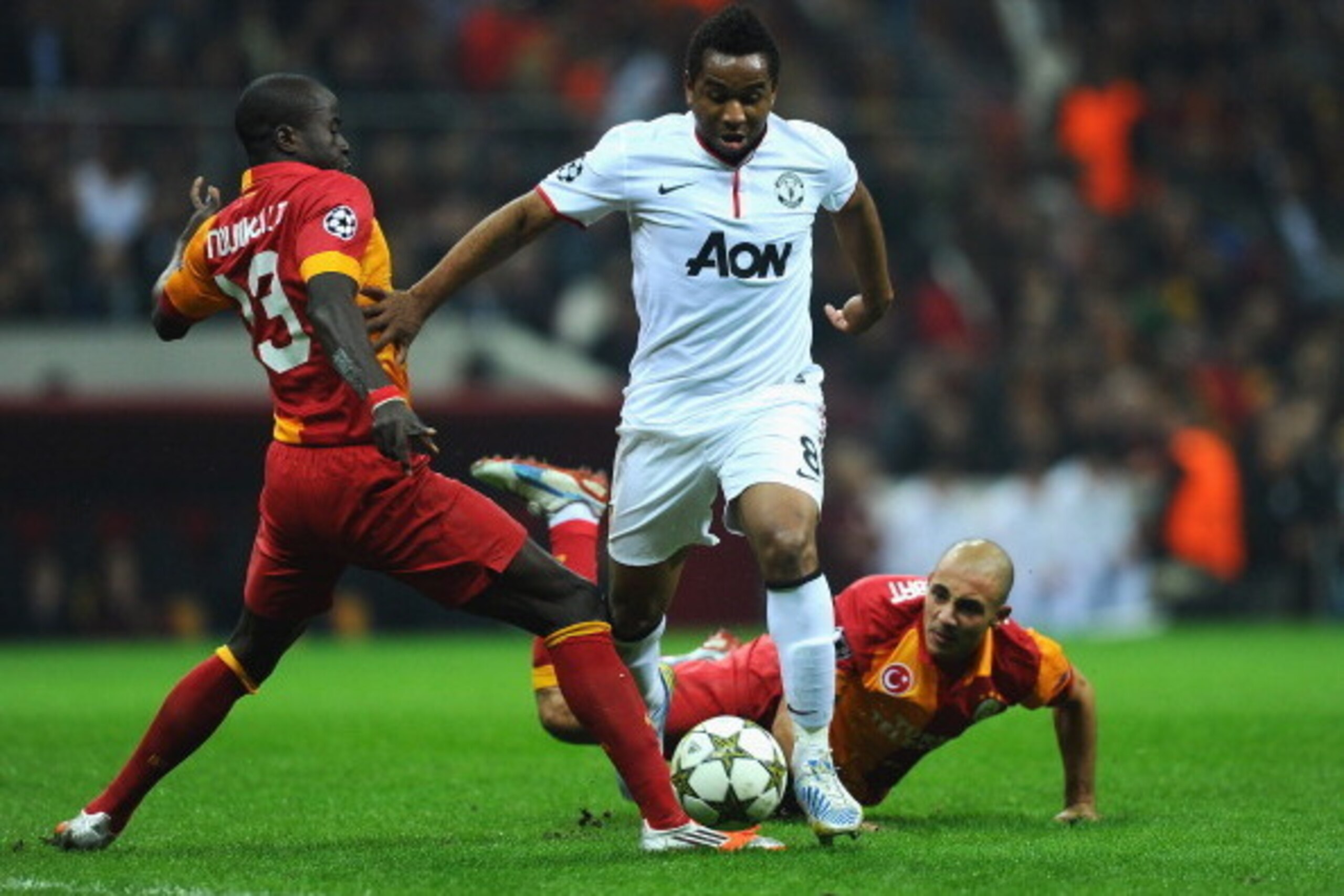 ISTANBUL, TURKEY - NOVEMBER 20:  Anderson of Manchester United battles with Nordin Amrabat of Galatasary during the UEFA Champions League Group H match between Galatasaray and Manchester United at the Turk Telekom Arena on November 20, 2012 in Istanbul, T