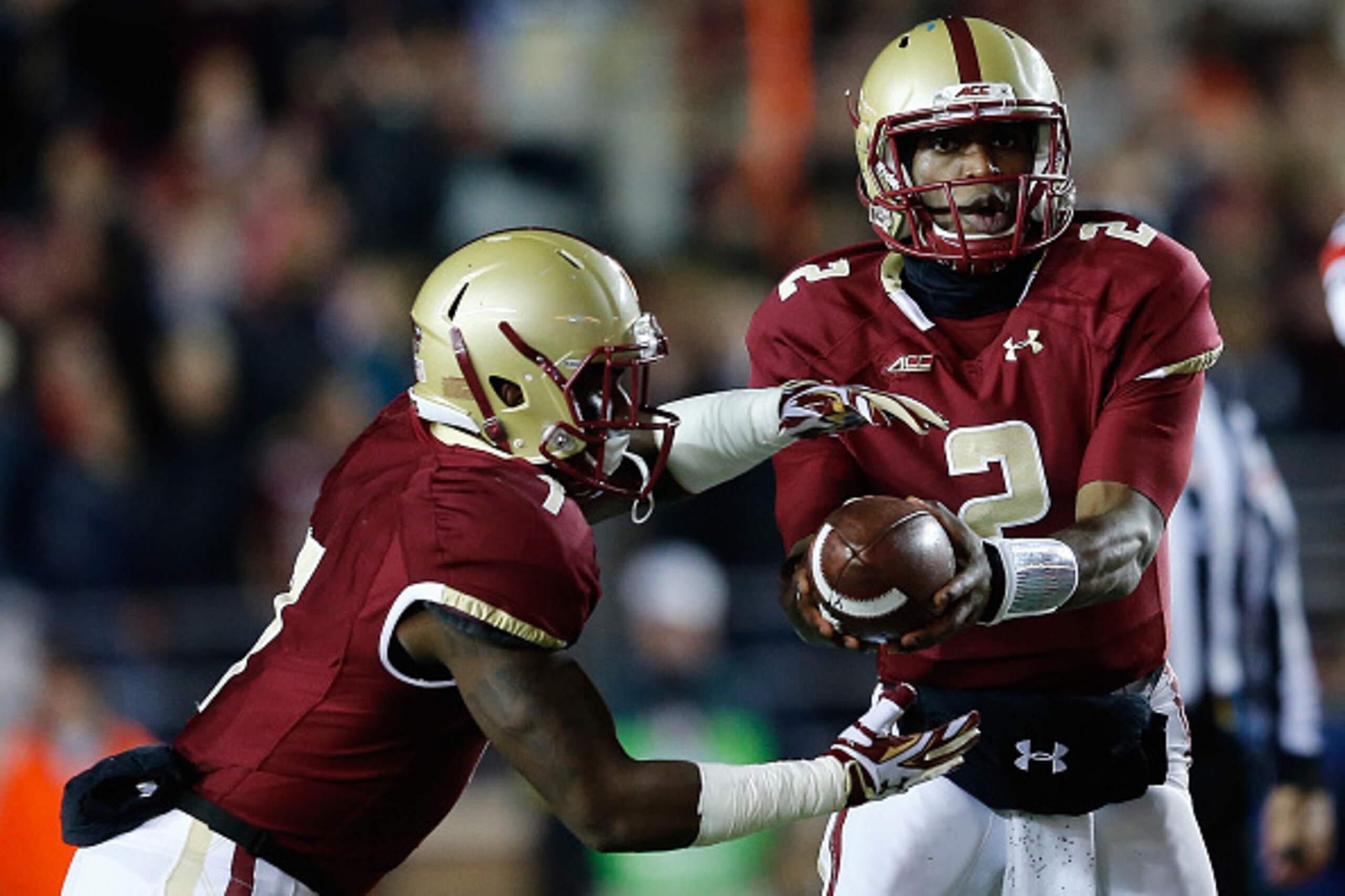 CHESTNUT HILL, MA - NOVEMBER 8: Tyler Murphy #2 of the Boston College Eagles hands the ball to Marcus Outlow #7 against the Louisville Cardinals in the first quarter at Alumni Stadium on November 8, 2014 in Chestnut Hill, Massachusetts. (Photo by Jim Roga