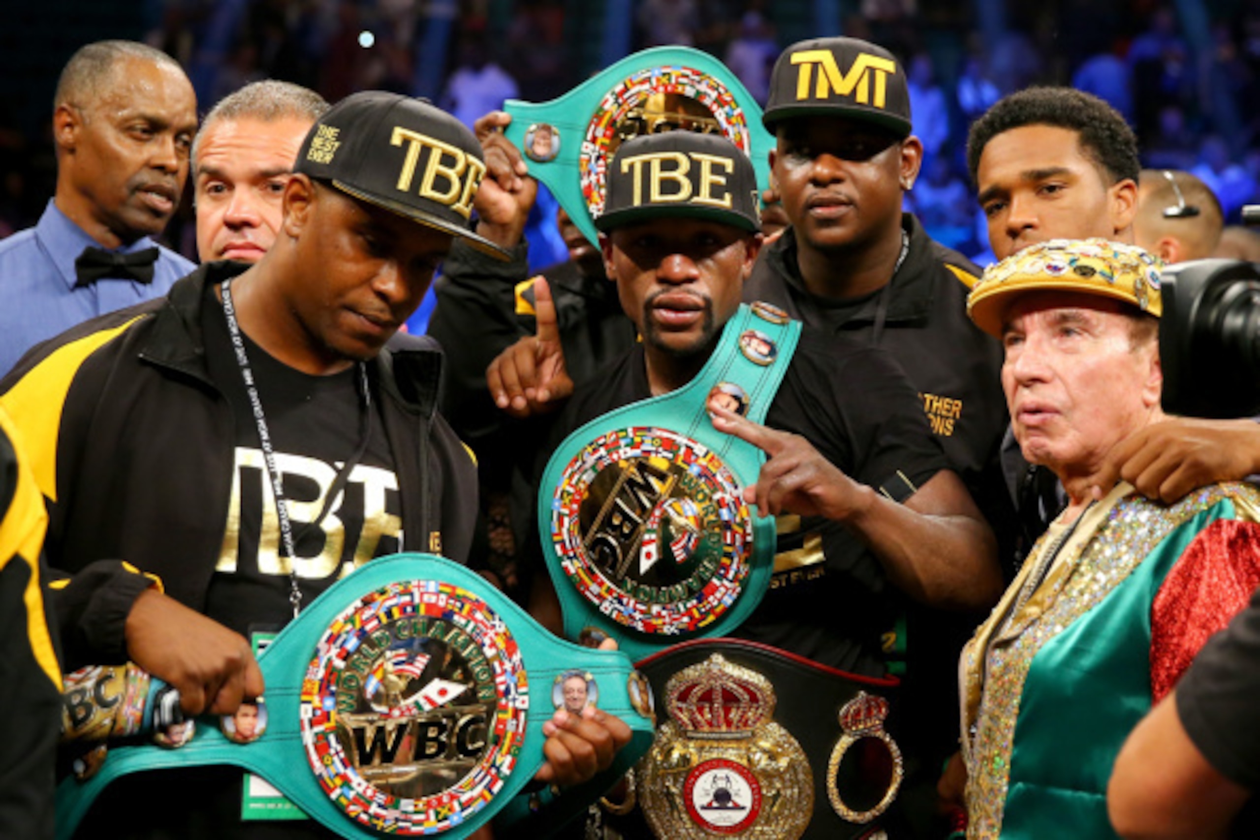 LAS VEGAS, NV - SEPTEMBER 13:  Floyd Mayweather Jr. celebrates his unanimous-decision victory over Marcos Maidana during their WBC/WBA welterweight title fight at the MGM Grand Garden Arena on September 13, 2014 in Las Vegas, Nevada.  (Photo by Al Bello/G