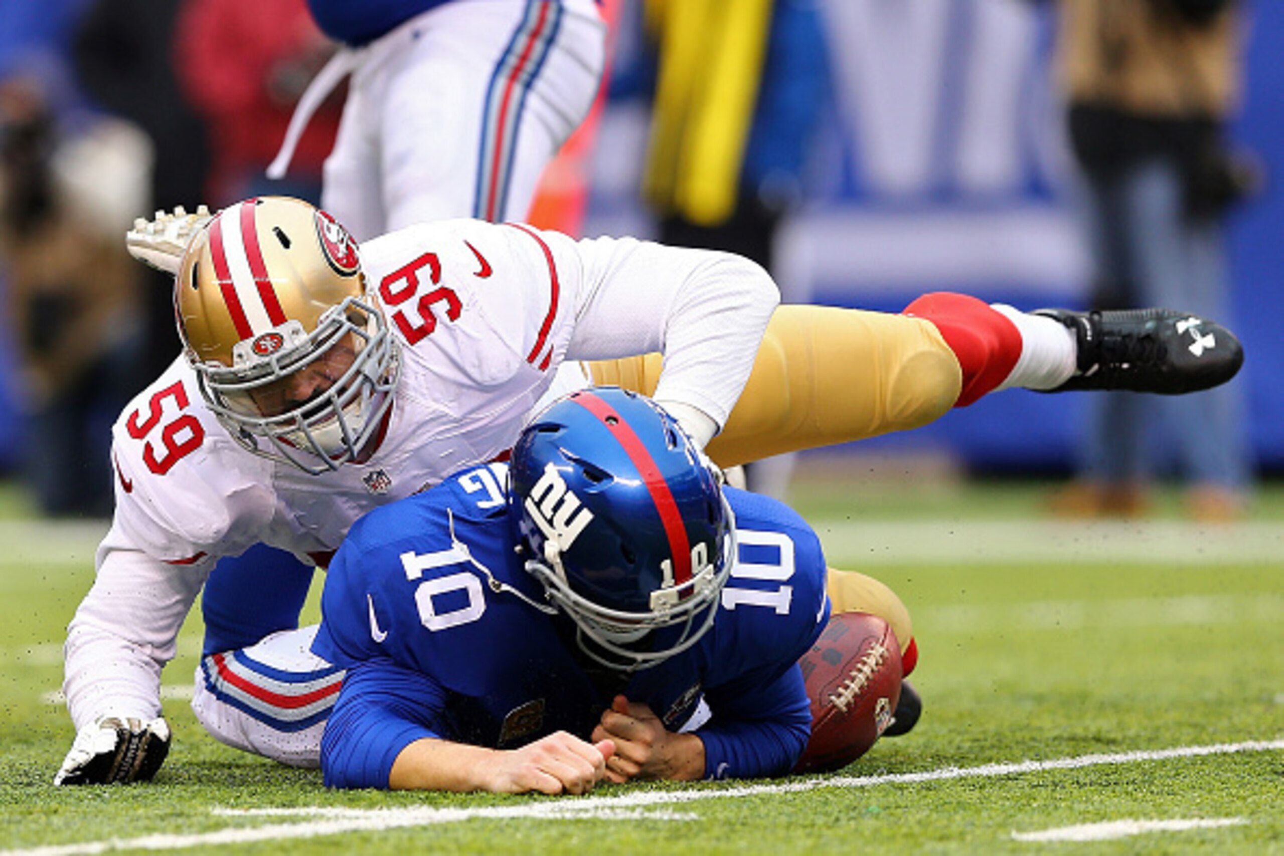 EAST RUTHERFORD, NJ - NOVEMBER 16: Aaron Lynch #59 of the San Francisco 49ers sacks Eli Manning #10 of the New York Giants in the third quarter at MetLife Stadium on November 16, 2014 in East Rutherford, New Jersey. (Photo by Elsa/Getty Images) EAST RUTHERFORD, NJ - NOVEMBER 16: Aaron Lynch #59 of the San Francisco 49ers sacks Eli Manning #10 of the New York Giants in the third quarter at MetLife Stadium on November 16, 2014 in East Rutherford, New Jersey. (Photo by Elsa/Getty Images)