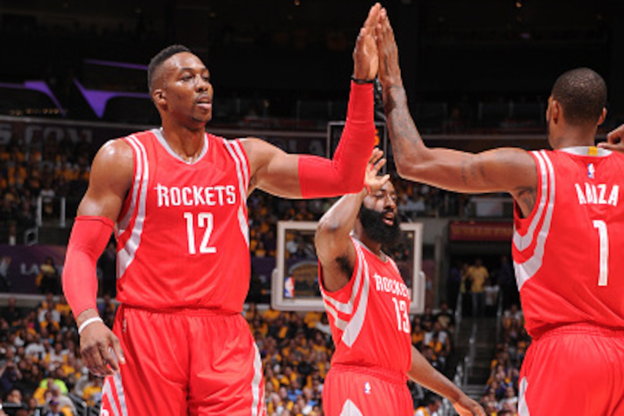 Los Angeles, CA- OCTOBER 28:  Dwight Howard #12 and Trevor Ariza #1 of the Houston Rockers slap hands during the game against the Los Angeles Lakers on October 28, 2014 at the Staples Center in Los Angeles, California. NOTE TO USER:  User expressly acknow