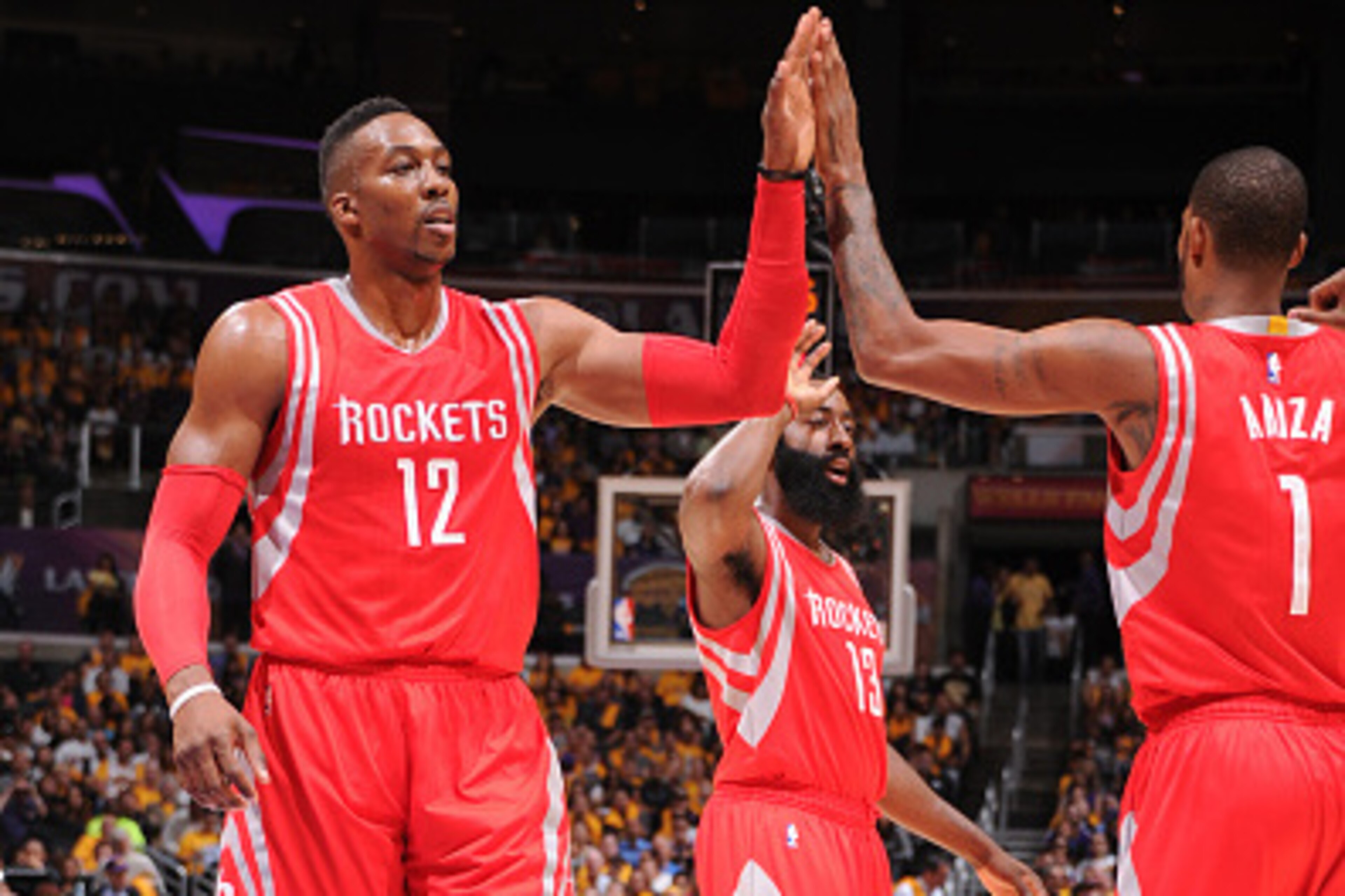 Los Angeles, CA- OCTOBER 28:  Dwight Howard #12 and Trevor Ariza #1 of the Houston Rockers slap hands during the game against the Los Angeles Lakers on October 28, 2014 at the Staples Center in Los Angeles, California. NOTE TO USER:  User expressly acknow