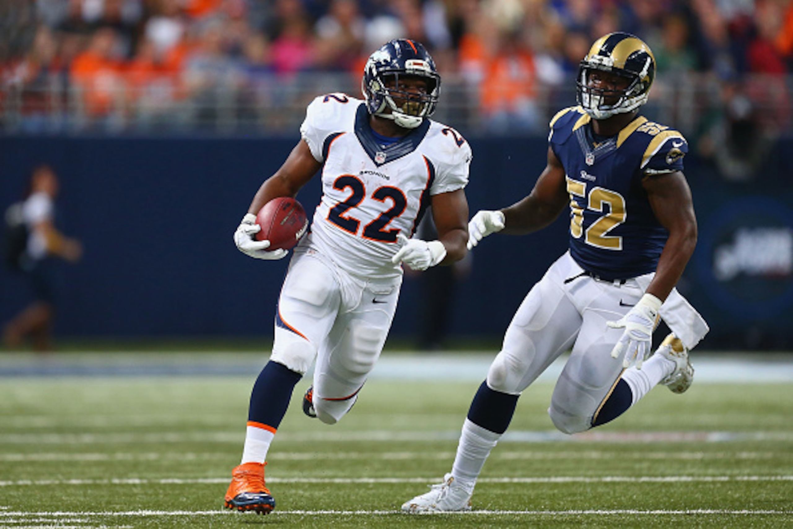 ST. LOUIS, MO - NOVEMBER 16: C.J. Anderson #22 of the Denver Broncos avoids Alec Ogletree #52 of the St. Louis Rams after making a catch in the second quarter at the Edward Jones Dome on November 16, 2014 in St. Louis, Missouri.  The Rams beat the Broncos