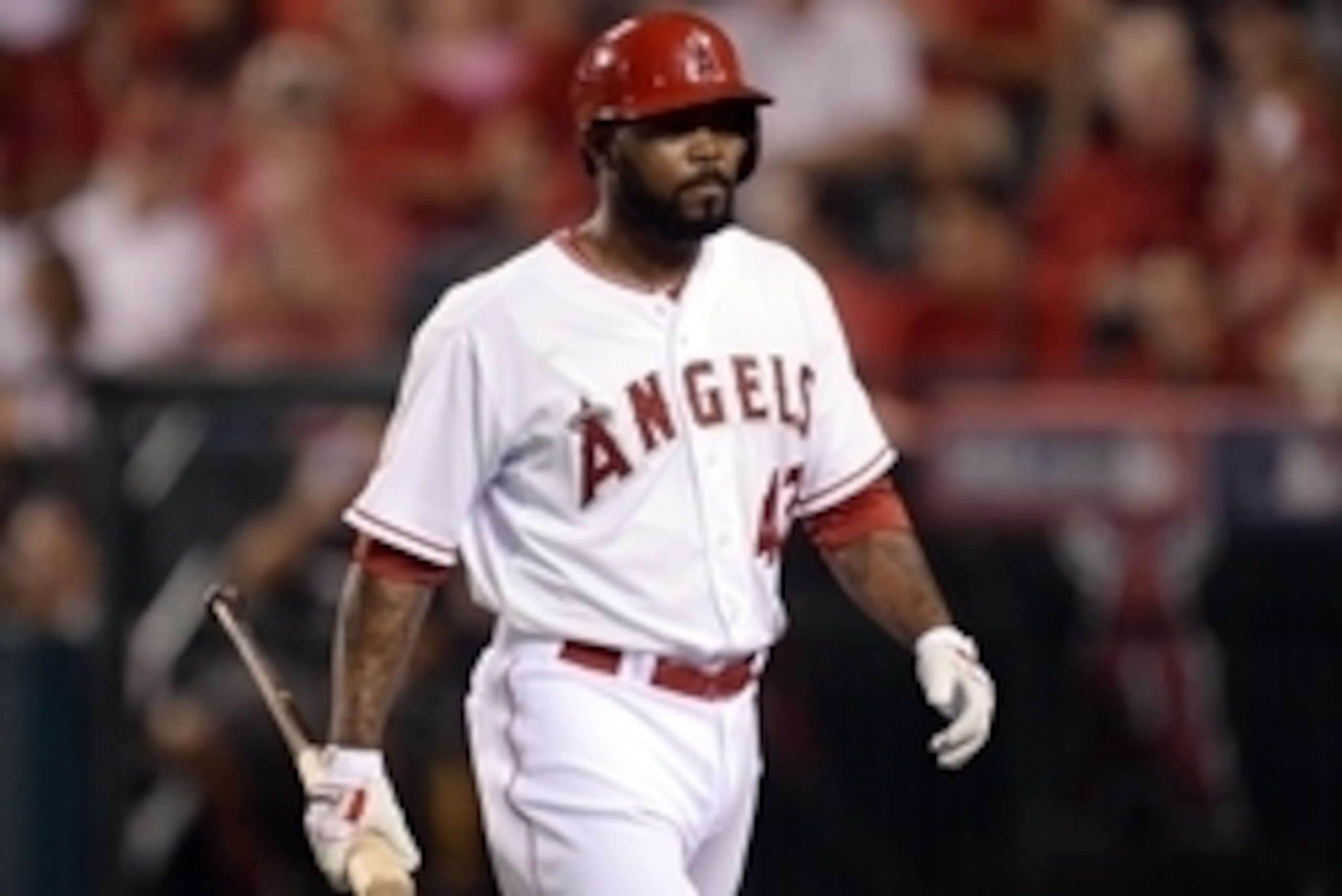 Oct 3, 2014; Anaheim, CA, USA; Los Angeles Angels second baseman Howie Kendrick heads to the dugout after striking out against the Kansas City Royals in the second inning in game two of the 2014 ALDS playoff baseball game at Angel Stadium of Anaheim. Mand