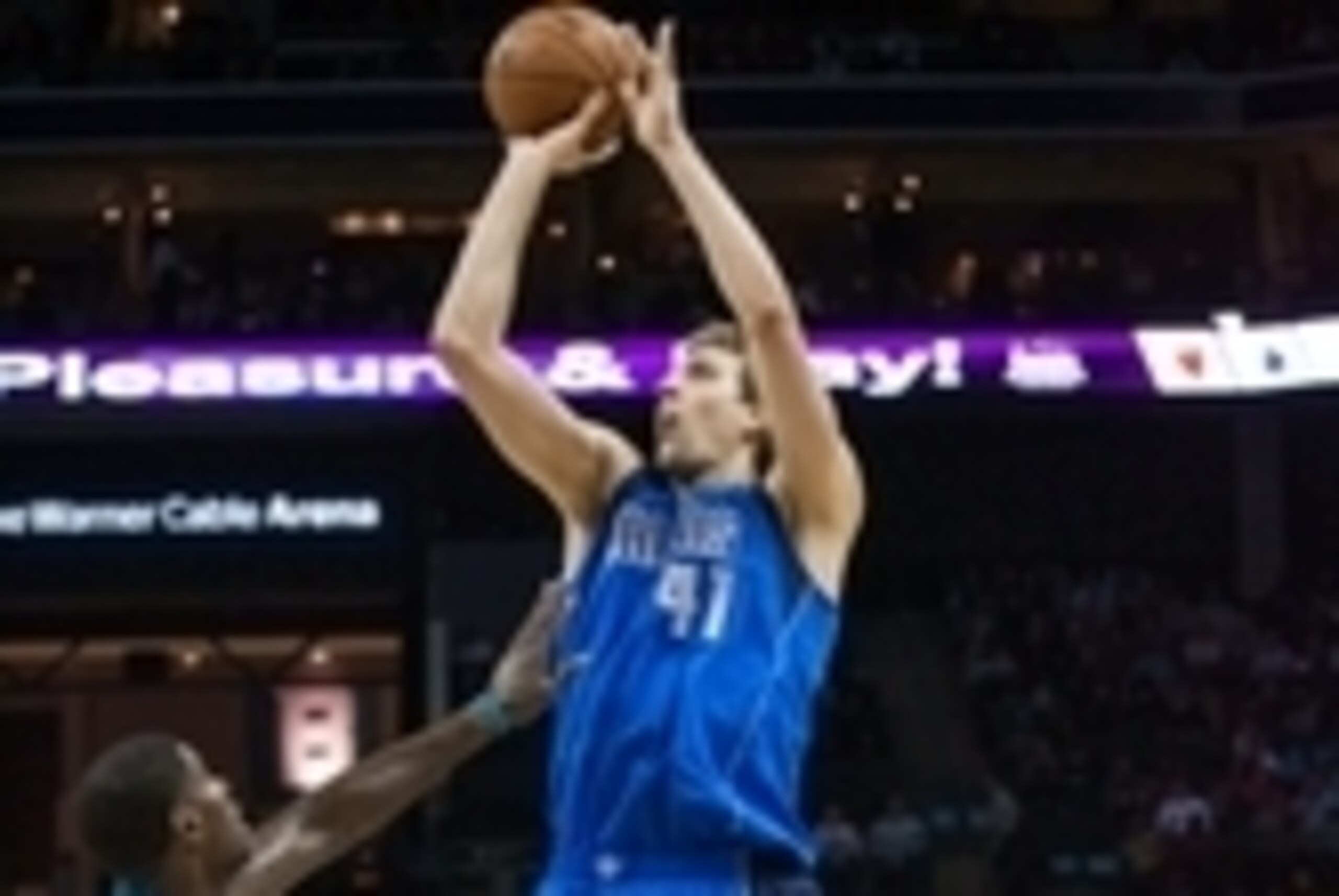 Nov 17, 2014; Charlotte, NC, USA; Dallas Mavericks forward Dirk Nowitzki (41) shoots the ball over Charlotte Hornets forward Marvin Williams (2) during the first half at Time Warner Cable Arena. Mandatory Credit: Jeremy Brevard-USA TODAY Sports