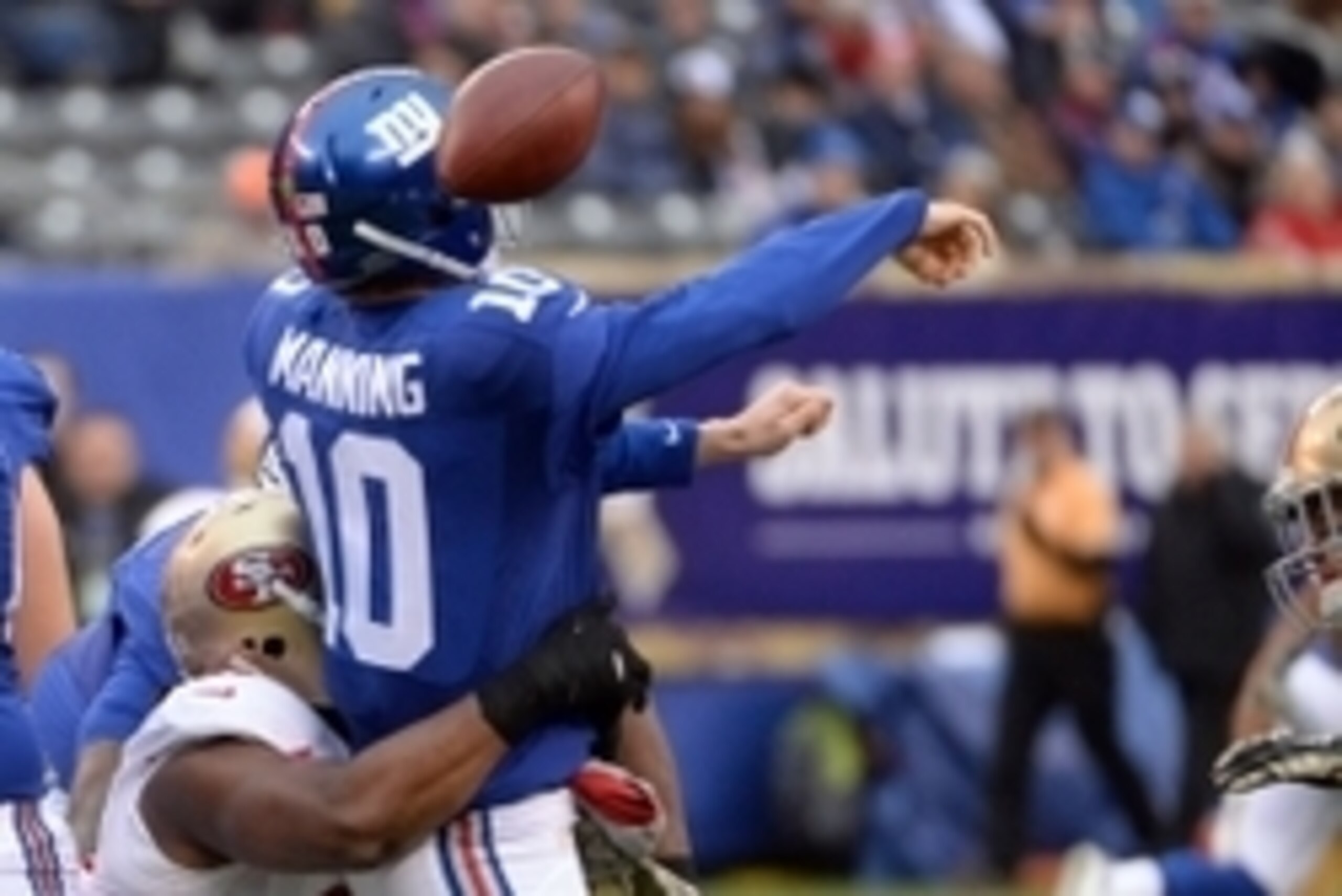 Nov 16, 2014; East Rutherford, NJ, USA; San Francisco 49ers defensive end Ray McDonald (91) causes New York Giants quarterback Eli Manning (10) to fumble during the third quarter at MetLife Stadium. Mandatory Credit: Robert Deutsch-USA TODAY Sports