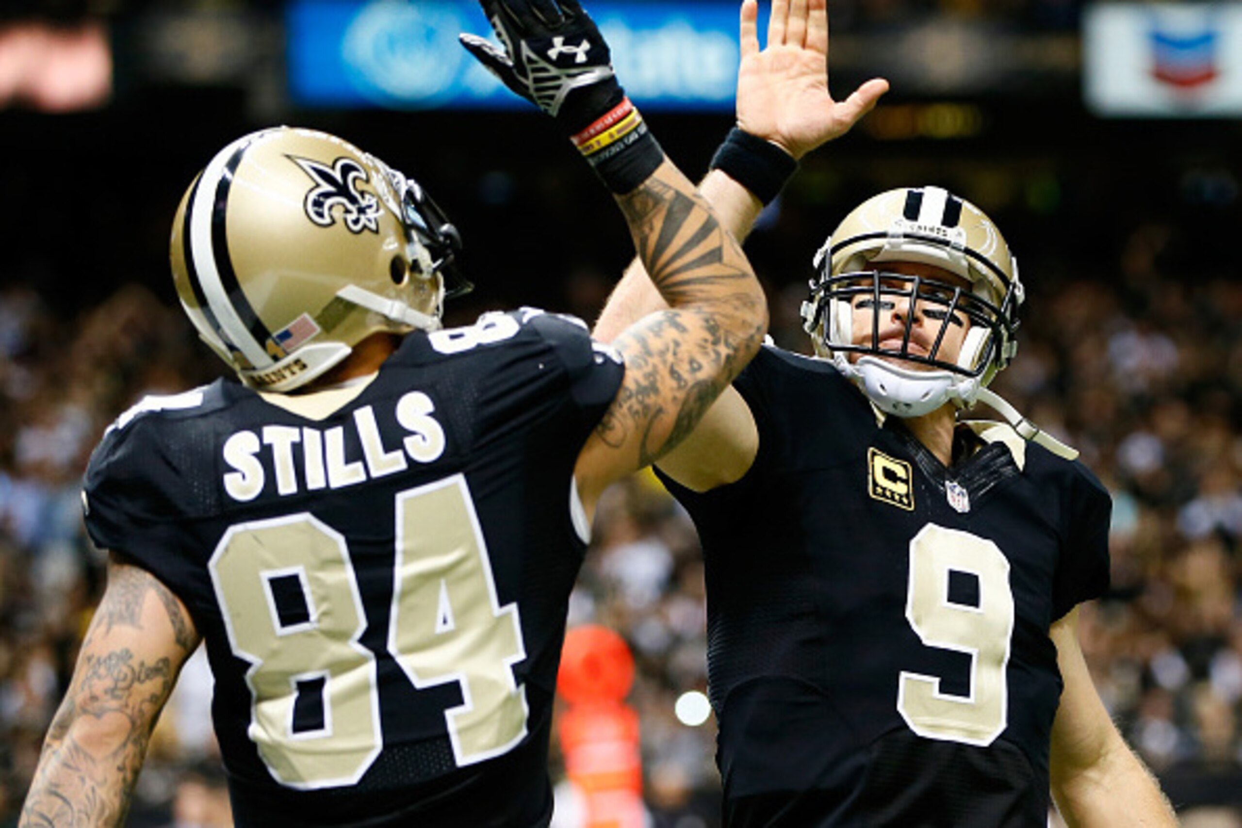NEW ORLEANS, LA - NOVEMBER 16:  Kenny Stills #84 of the New Orleans Saints and  Drew Brees #9 celebrate a touchdown during the second half against the New Orleans Saints at Mercedes-Benz Superdome on November 16, 2014 in New Orleans, Louisiana.  (Photo by