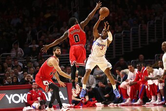 LOS ANGELES, CA - NOVEMBER 17: Aaron Broks #0 of the Chicago Bulls blocks a pass attempt by Chris Paul #3 of the Los Angeles Clippers at Staples Center on November 17, 2014 in Los Angeles, California.  NOTE TO USER: User expressly acknowledges and agrees 