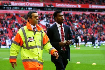 LIVERPOOL, ENGLAND - SEPTEMBER 27:  The injured Daniel Sturridge of Liverpool takes his seat prior to kickoff during the Barclays Premier League match between Liverpool and Everton at Anfield on September 27, 2014 in Liverpool, England.  (Photo by Alex Li