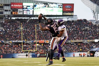 CHICAGO, IL - NOVEMBER 16: Brandon Marshall #15 of the Chicago Bears catches a touchdown pass over Josh Robinson #21 of the Minnesota Vikings during the fourth quarter of a game at Soldier Field on November 16, 2014 in Chicago, Illinois. (Photo by David B