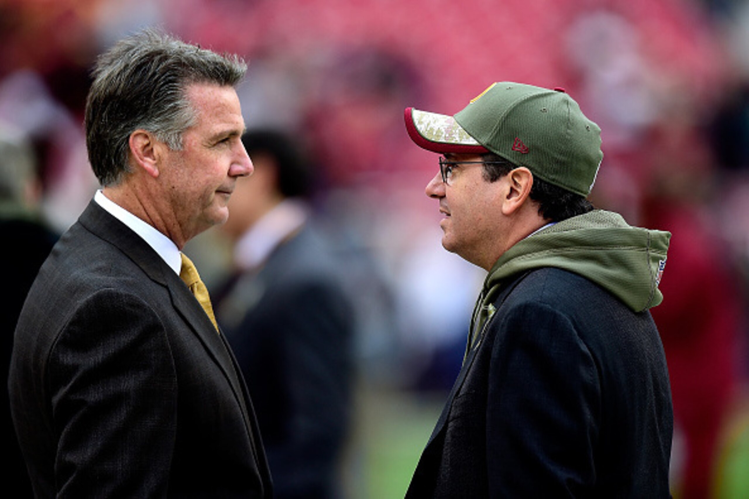 LANDOVER, MD - NOVEMBER 16:  Washington Redskins Owner Dan Snyder (R) speaks with General Manager Bruce Allen before a game against the Tampa Bay Buccaneers at FedExField on November 16, 2014 in Landover, Maryland.  (Photo by Patrick McDermott/Getty Image