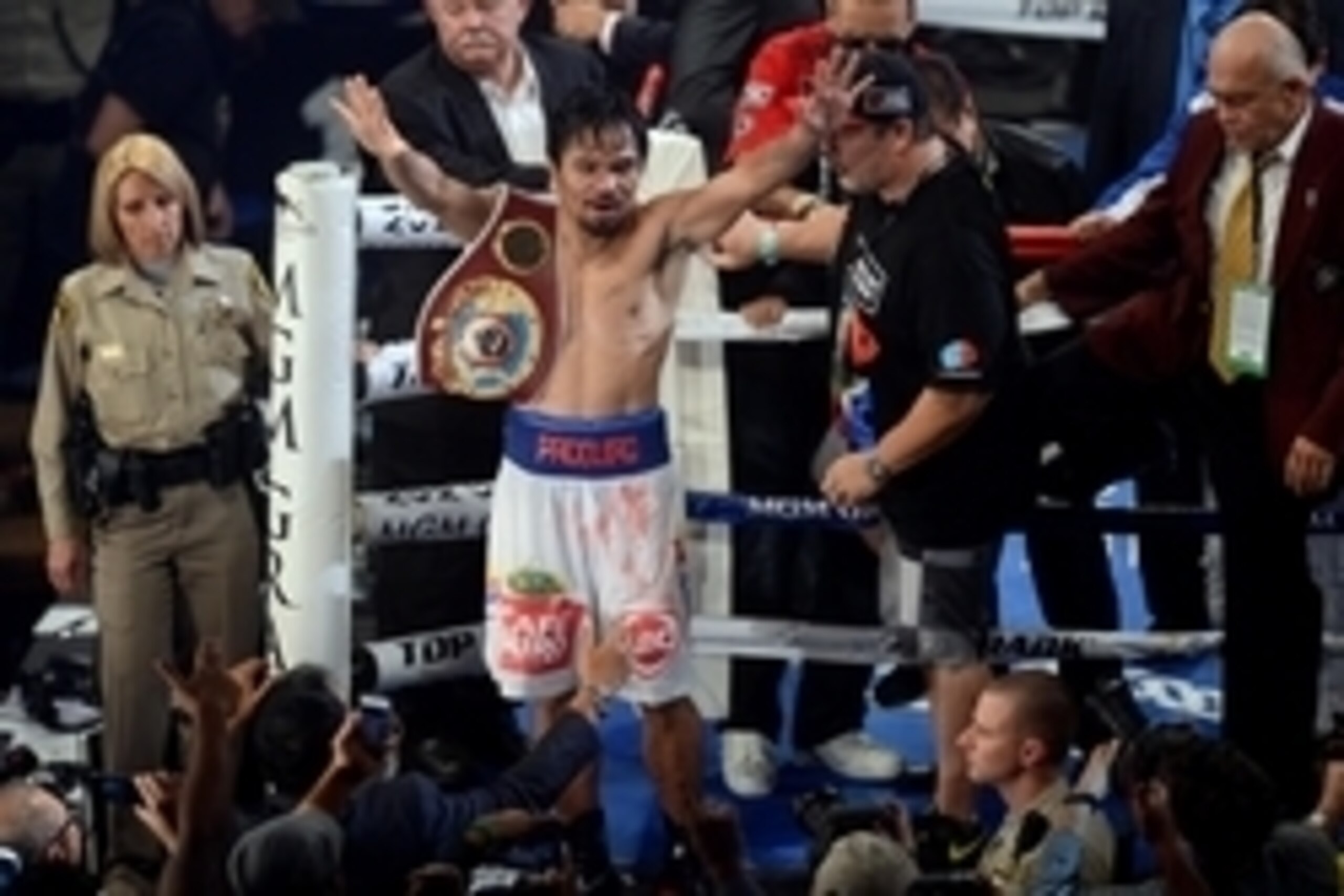 Apr 12, 2014; Las Vegas, NV, USA; Manny Pacquiao celebrates after defeating Tomothy Bradley Jr. (not pictured in their WBO World Welterweight Title bout at MGM Grand Garden Arena. Pacquiao won via unanimous decision. Mandatory Credit: Joe Camporeale-USA T