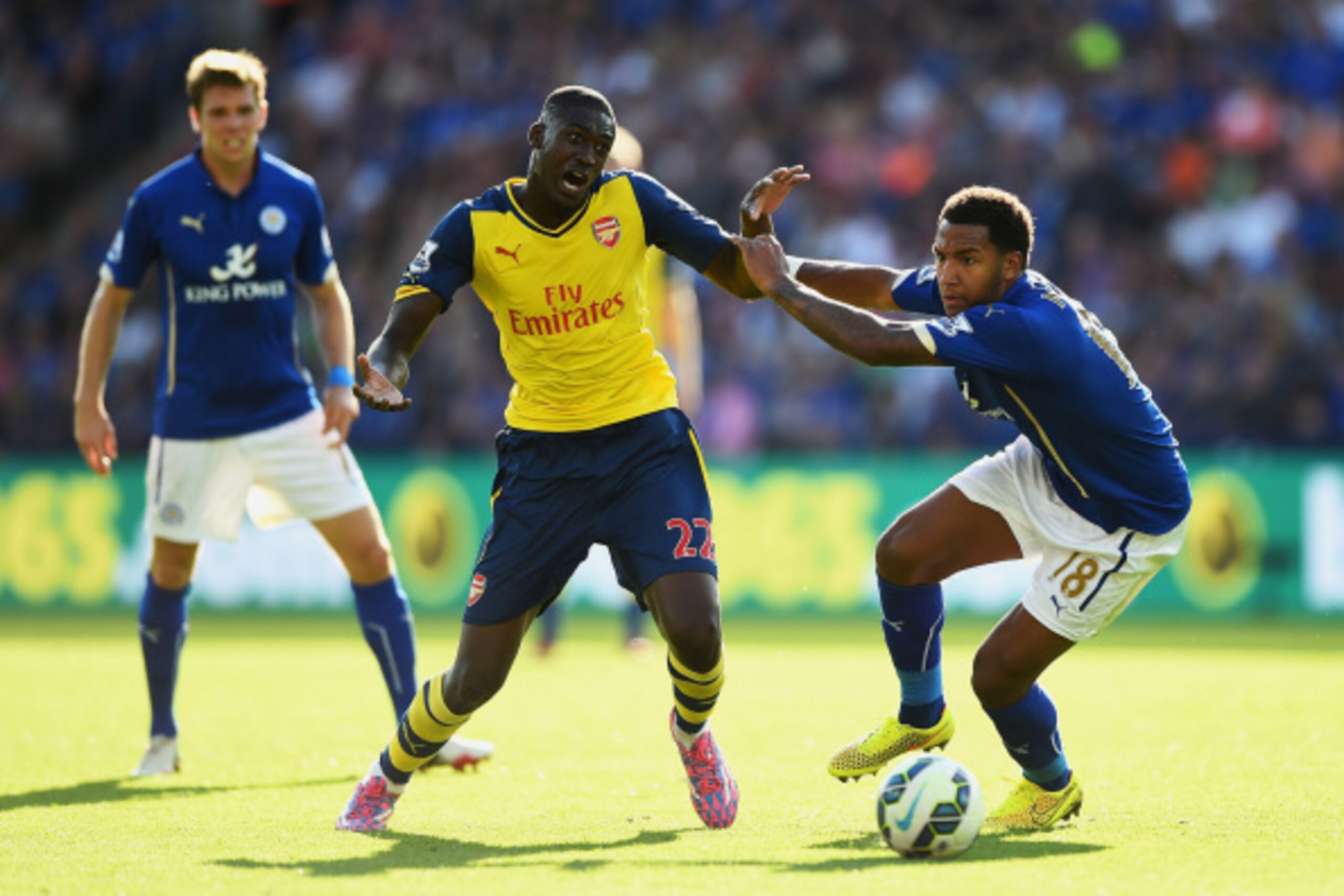 LEICESTER, ENGLAND - AUGUST 31: Yaya Sanogo of Arsenal is challenged by Liam Moore of Leicester City during the Barclays Premier League match between Leicester City and Arsenal at The King Power Stadium on August 31, 2014 in Leicester, England. (Photo by LEICESTER, ENGLAND - AUGUST 31: Yaya Sanogo of Arsenal is challenged by Liam Moore of Leicester City during the Barclays Premier League match between Leicester City and Arsenal at The King Power Stadium on August 31, 2014 in Leicester, England. (Photo by