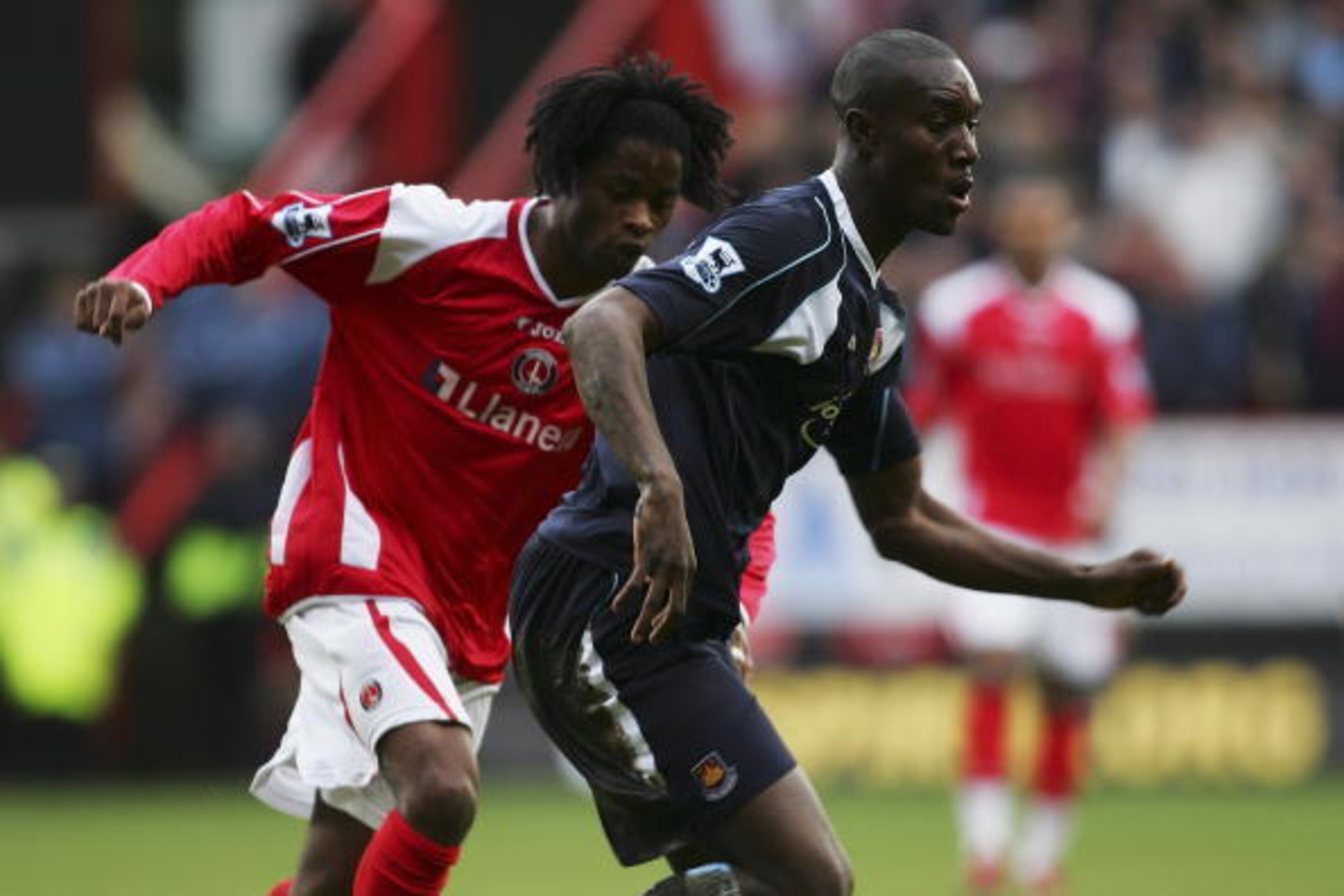LONDON - FEBRUARY 24:  Carlton Cole of West Ham United evades Alexandre Song Billong of Charlton Athletic during the Barclays Premiership match between Charlton Athletic and West Ham United at The Valley on February 24, 2007 in London, England.  (Photo by