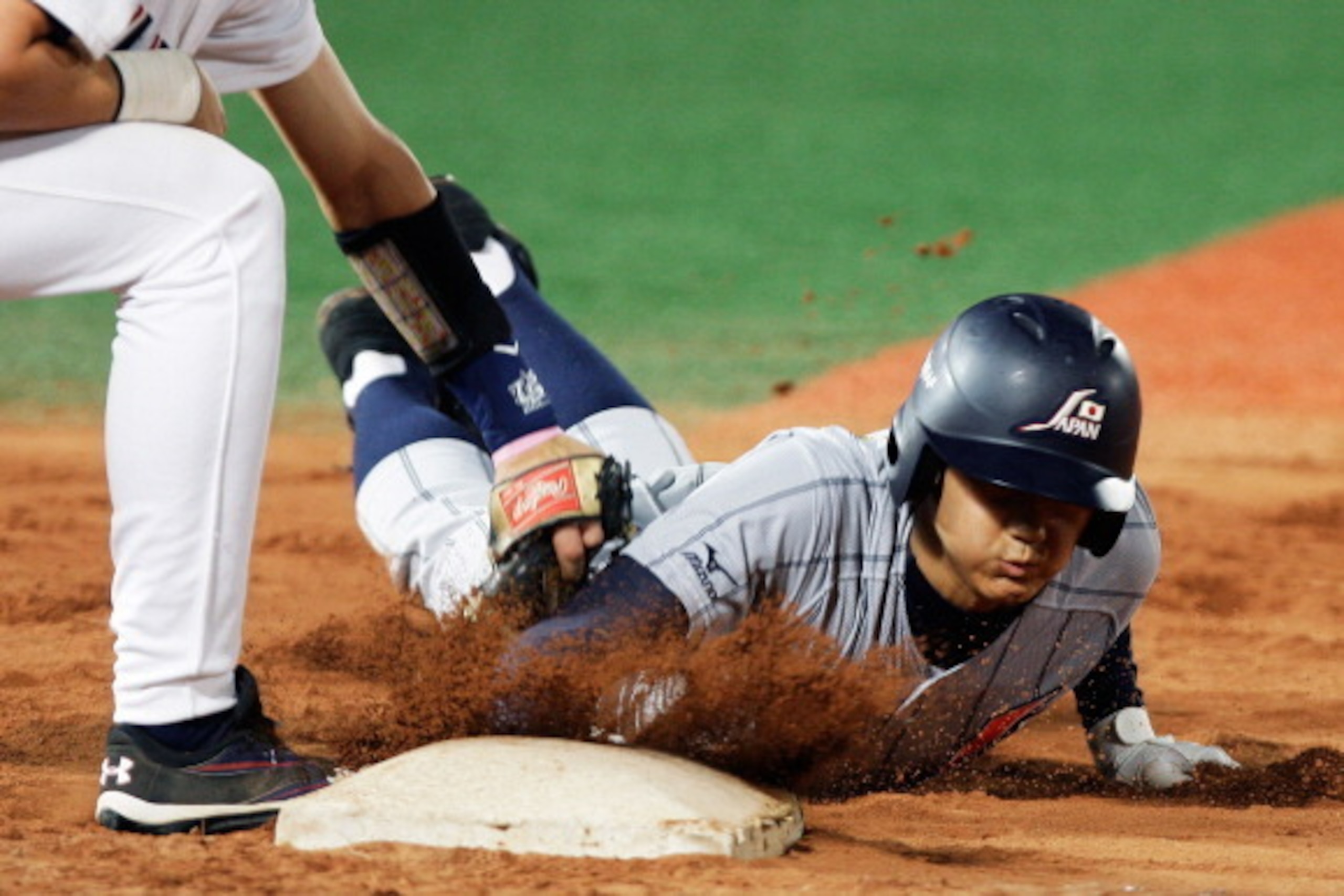 SEOUL, SOUTH KOREA - SEPTEMBER 07:  Cavan Biggio of United States tags out Shohei Otani of Japan as he slides into first base in the fifth inning during the U18 Baseball World Championship match between Japan and the United States at Mokdong stadium on Se