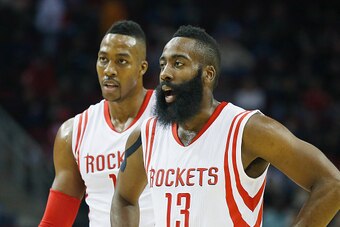 HOUSTON, TX - NOVEMBER 14:  James Harden #13 and Dwight Howard #12  of the Houston Rockets wait on the court during the game against the Philadelphia 76ers at the Toyota Center on November 14, 2014 in Houston, Texas.  NOTE TO USER: User expressly acknowle