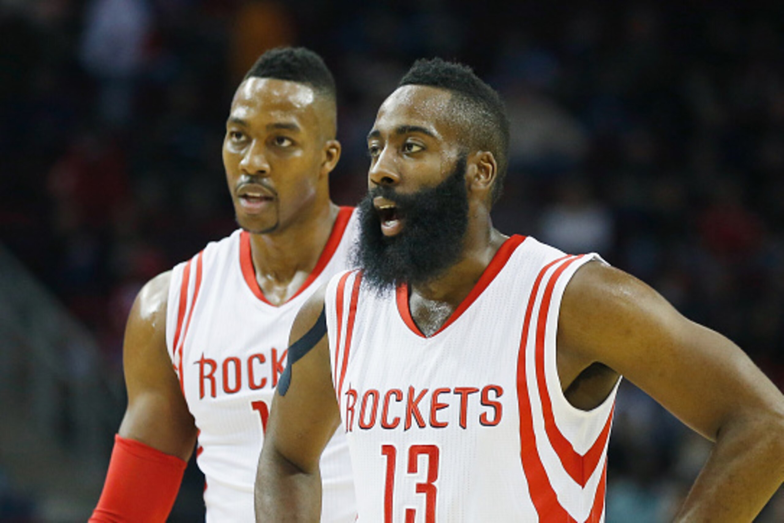 HOUSTON, TX - NOVEMBER 14:  James Harden #13 and Dwight Howard #12  of the Houston Rockets wait on the court during the game against the Philadelphia 76ers at the Toyota Center on November 14, 2014 in Houston, Texas.  NOTE TO USER: User expressly acknowle