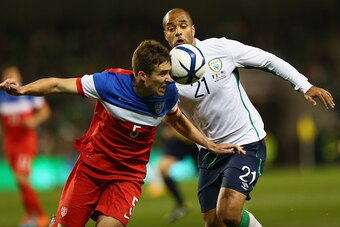 DUBLIN, IRELAND - NOVEMBER 18:  Matt Besler (L) of USA heads clear from David McGoldrick (R) of Irelandduring the International Friendly match between the Republic of Ireland and USA at the Aviva Stadium on November 18, 2014 in Dublin, Ireland.  (Photo by