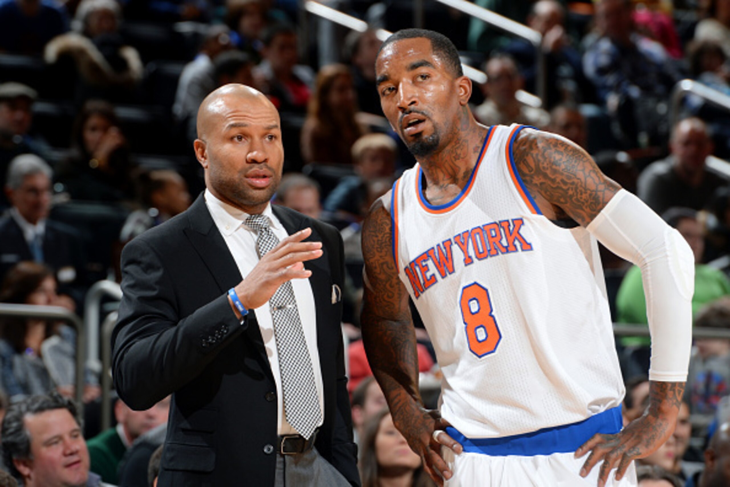 NEW YORK, NY - NOVEMBER 14: Derek Fisher and J.R. Smith #8 of the New York Knicks talk strategy during a game against the Utah Jazz on November 14, 2014 at Madison Square Garden in New York City.  NOTE TO USER: User expressly acknowledges and agrees that,