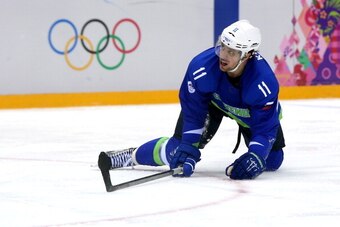 SOCHI, RUSSIA - FEBRUARY 18:  Anze Kopitar #11 of Slovenia looks on from the ice during the Men's Ice Hockey Qualification Playoff game against Austria on day eleven of the Sochi 2014 Winter Olympics at Bolshoy Ice Dome on February 18, 2014 in Sochi, Russ