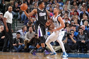 DALLAS, TX - NOVEMBER 11: Rudy Gay #8 of the Sacramento Kings looks to pass to a teammate against Chandler Parsons #25 of the Dallas Mavericks on November 11, 2014 at the American Airlines Center in Dallas, Texas. NOTE TO USER: User expressly acknowledges